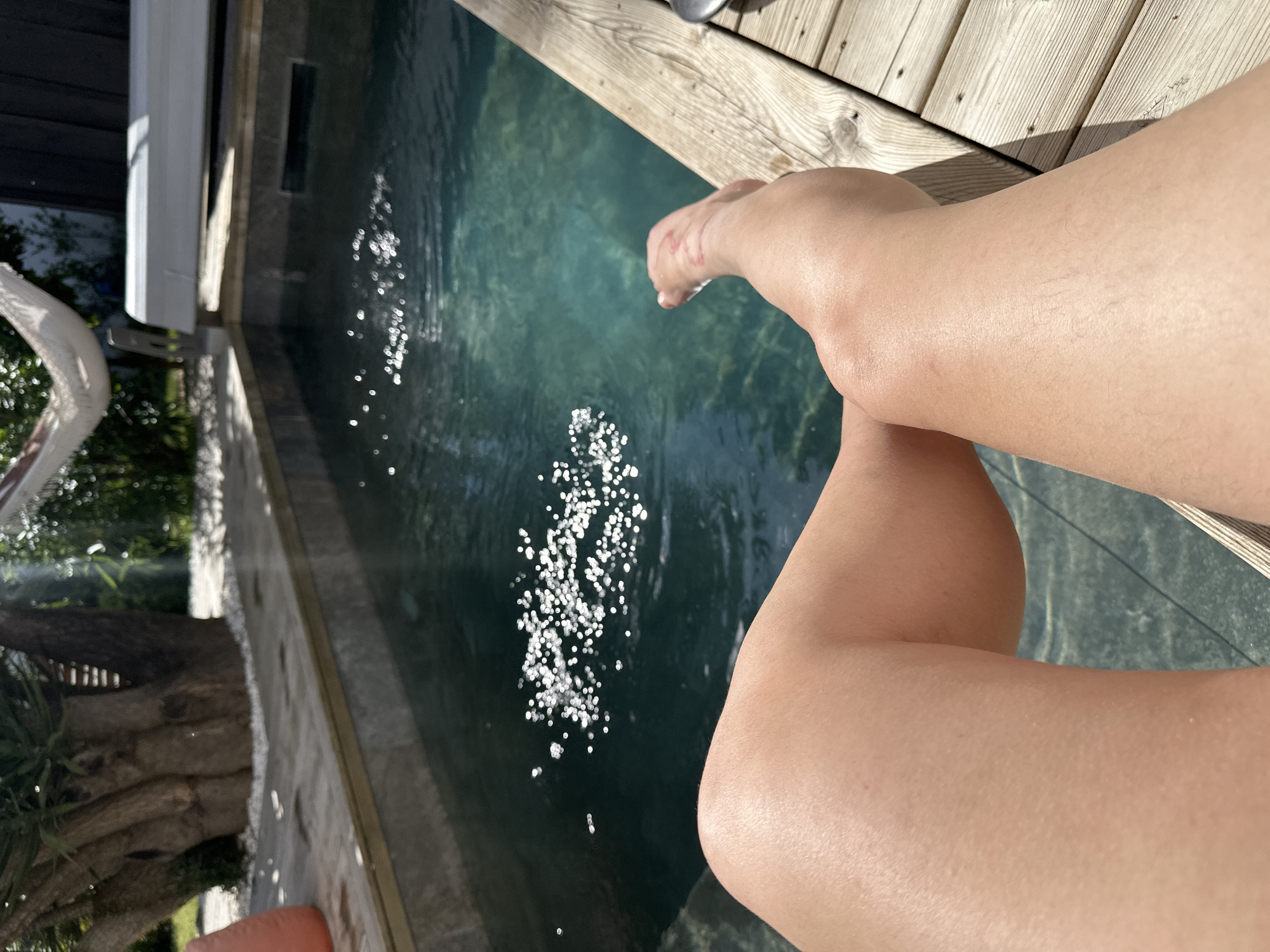 Lazy afternoon poolside gathering documented in French coastal town