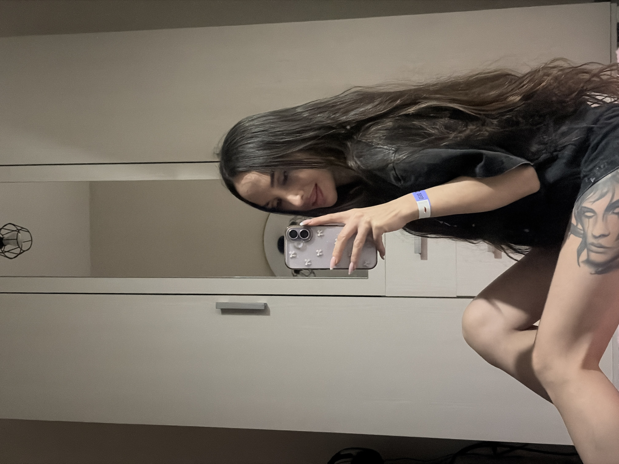 Woman takes selfies in front of wardrobe in Saint Petersburg