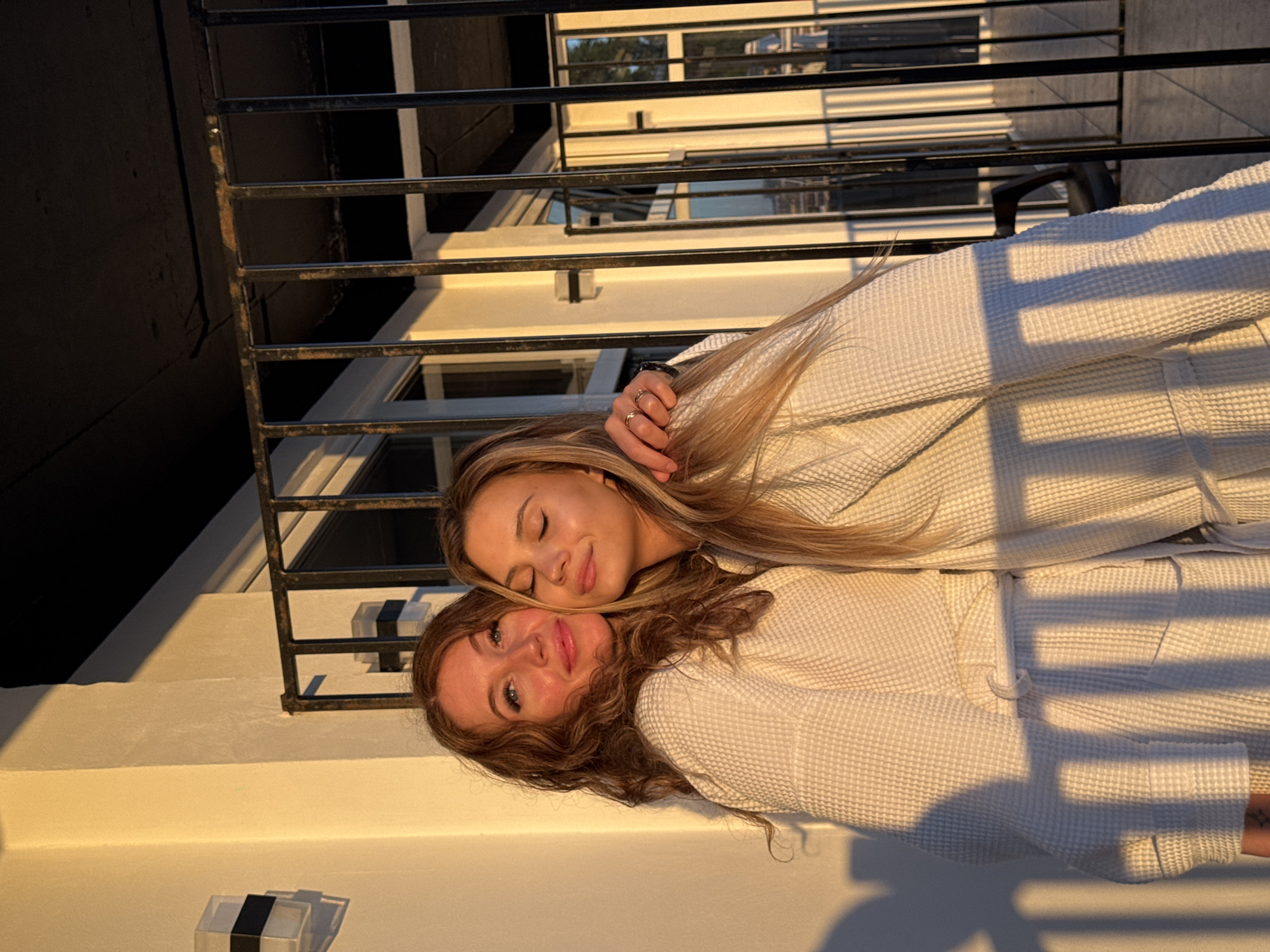 Two women share quiet moment in Sokhumi bathrobes