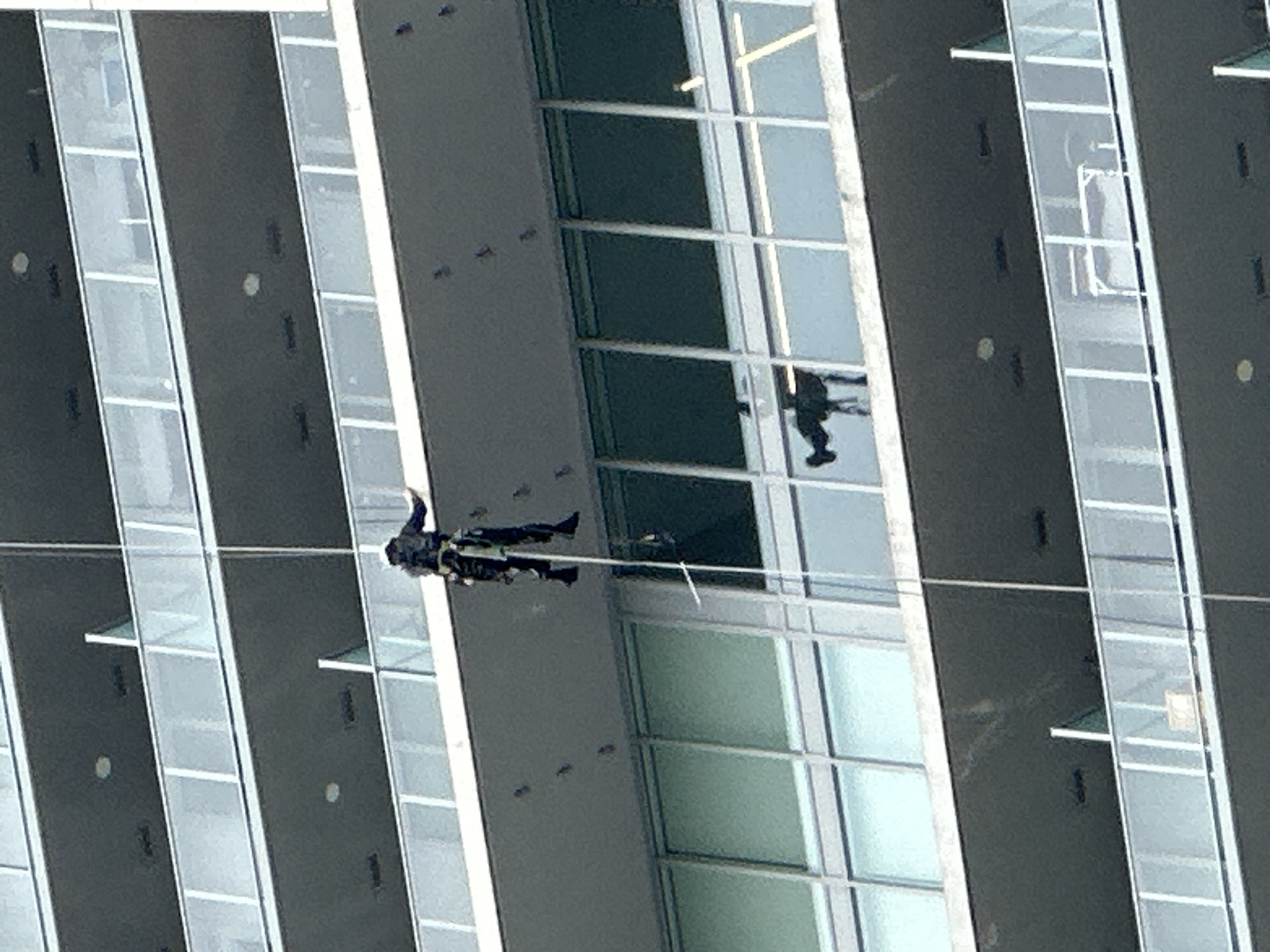 Urban scenes and cable-suspended figure documented in Coquitlam