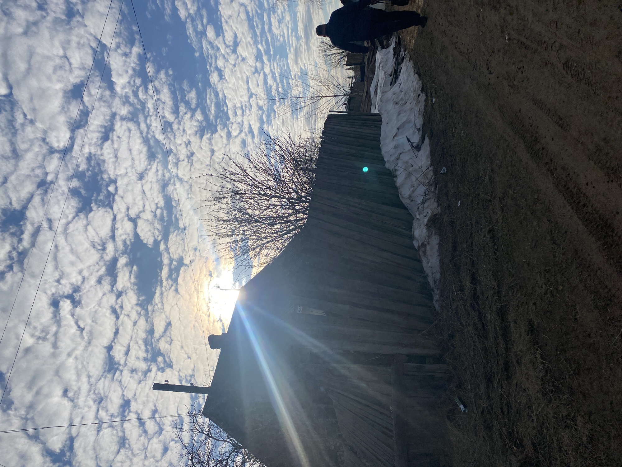 Person photographs self in rural Russian village