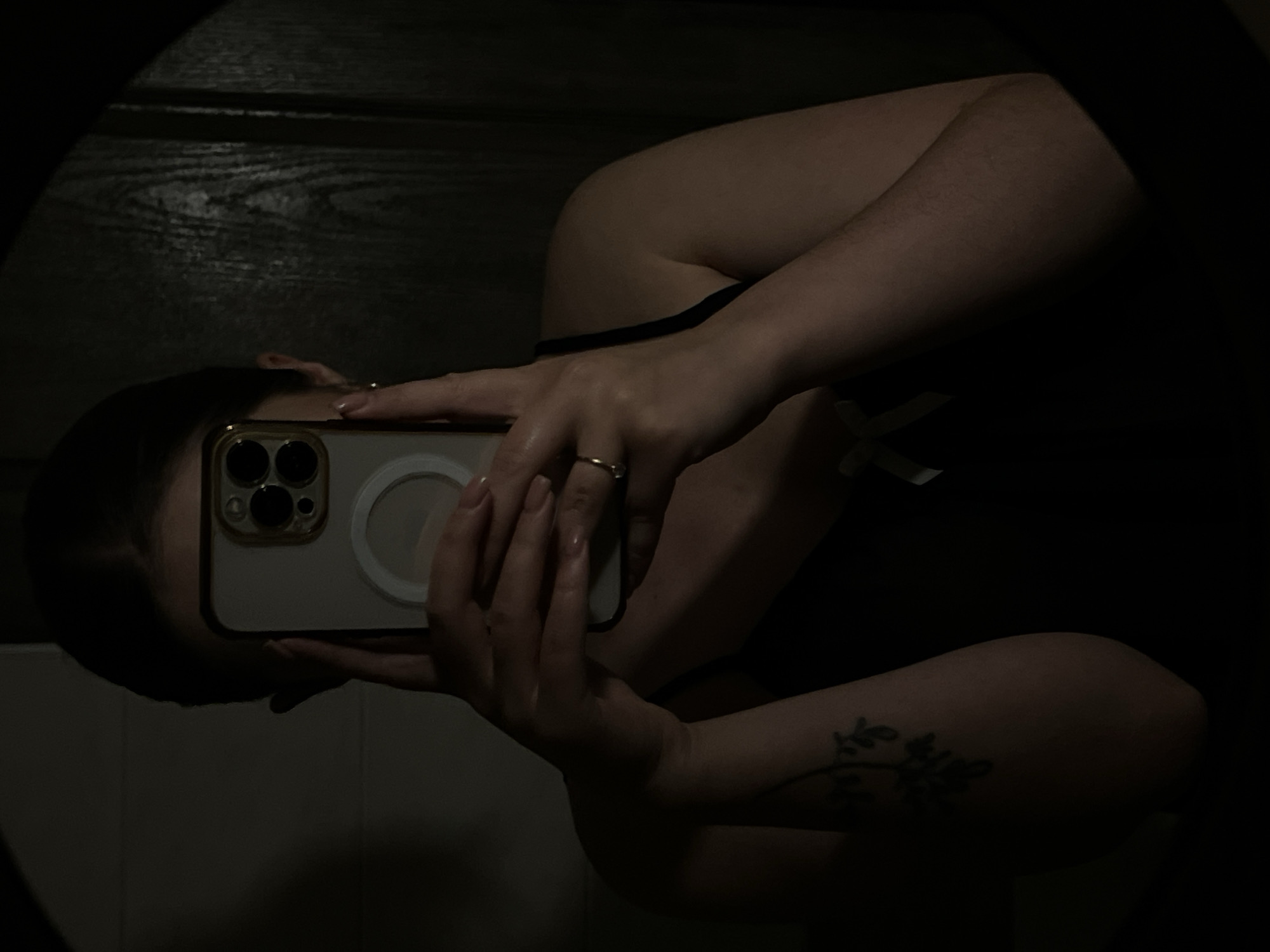 Person Takes Mirror Selfie with Gold-Cased Phone in Ternopil