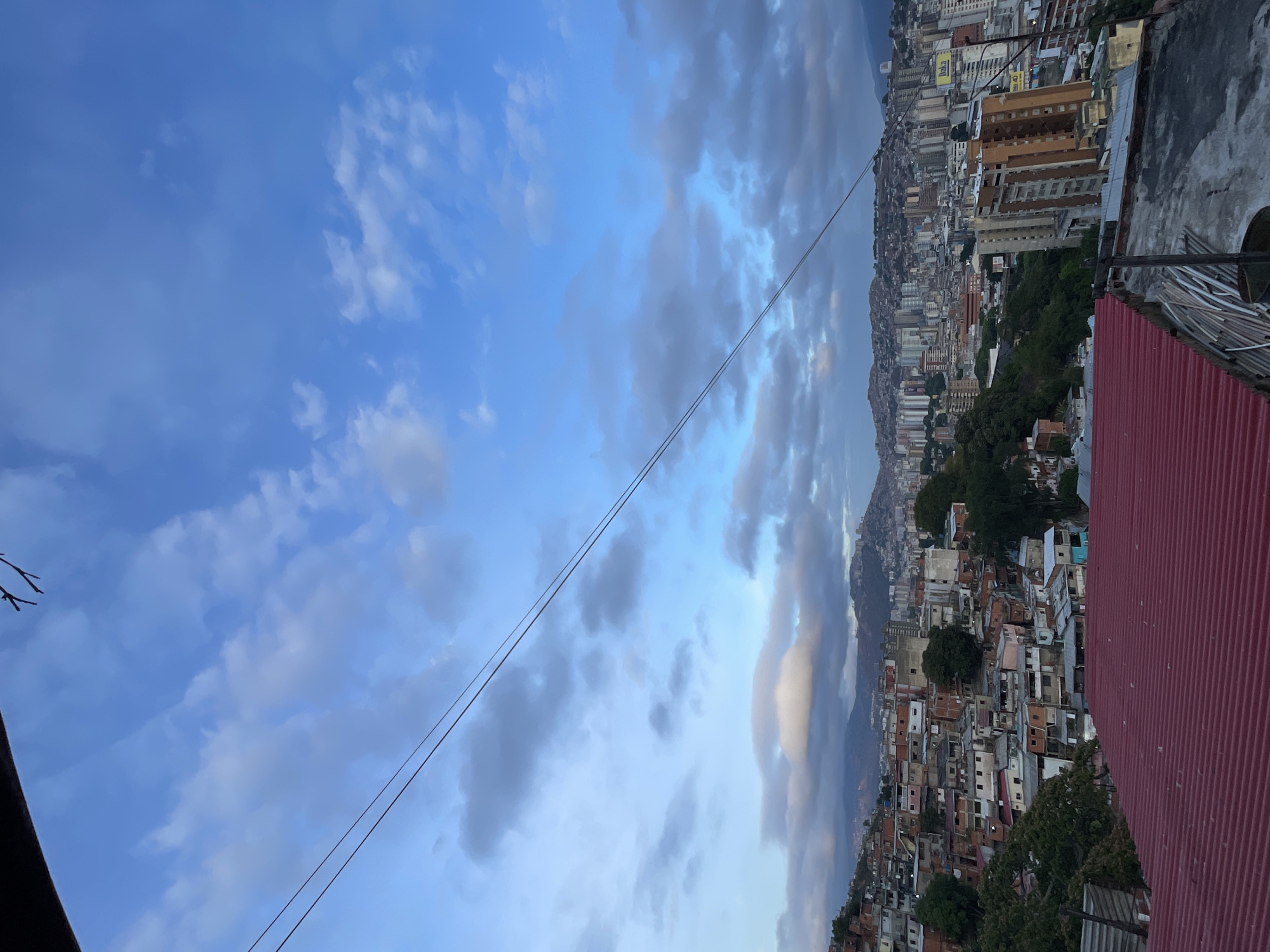 Witness documents Caracas cityscape under cloudy skies