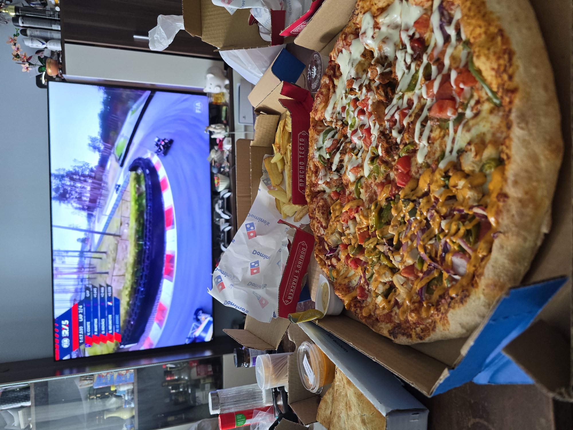 Partially eaten Domino's pizza observed in Sofia home