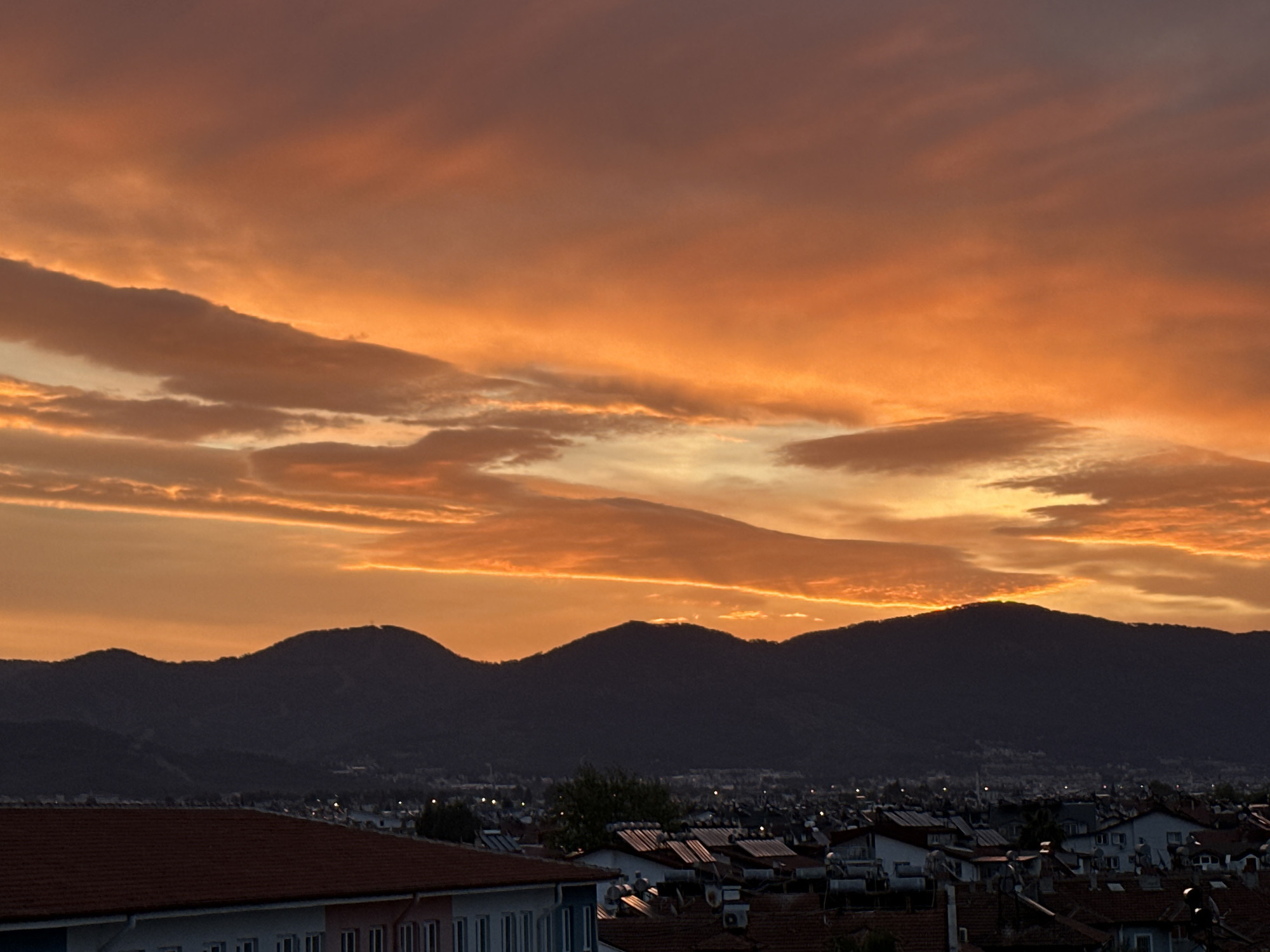 Vibrant sunrise illuminates Fethiye, Turkey skyline
