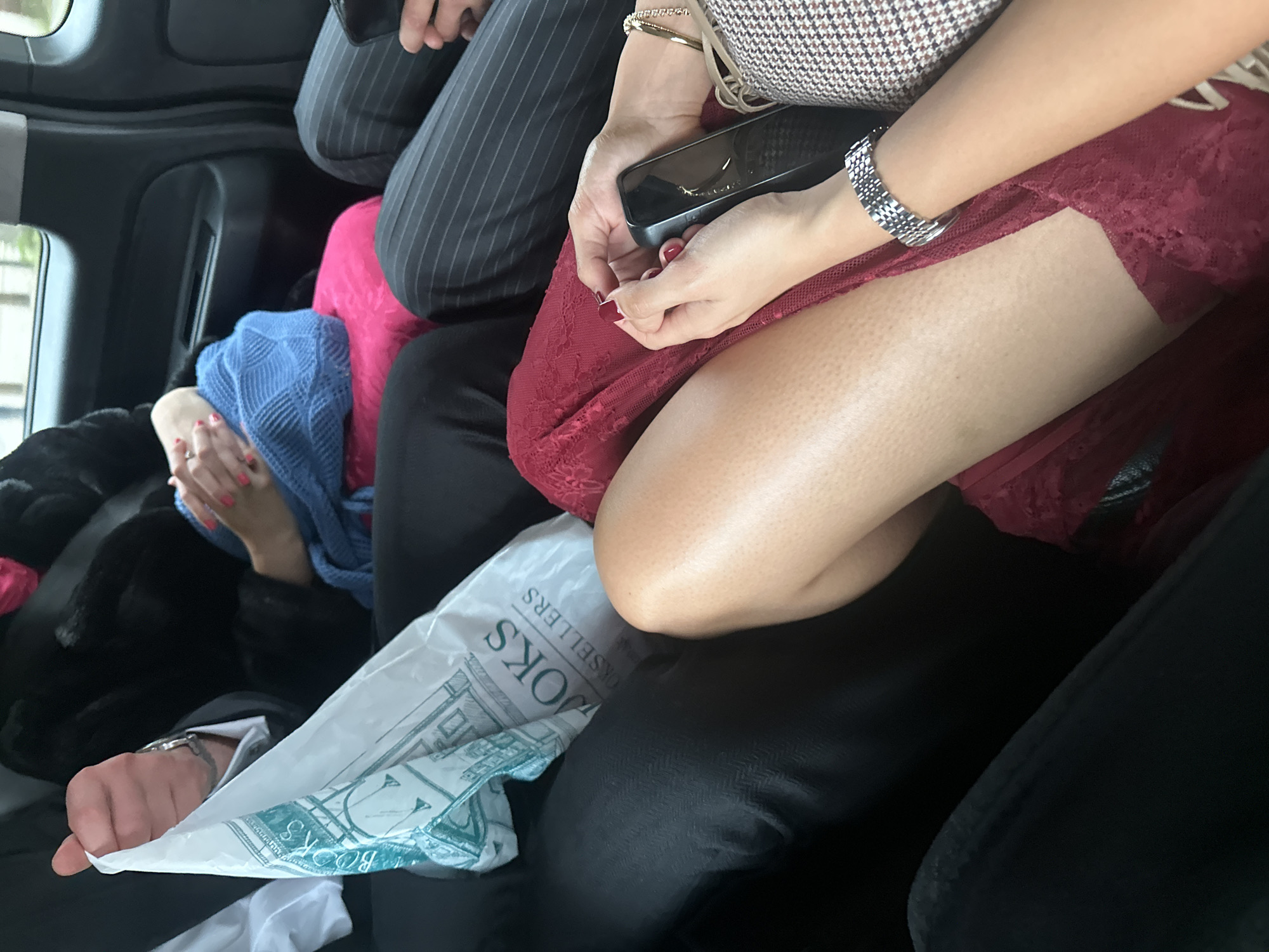 Crowded vehicle interior documented in London with multiple passengers