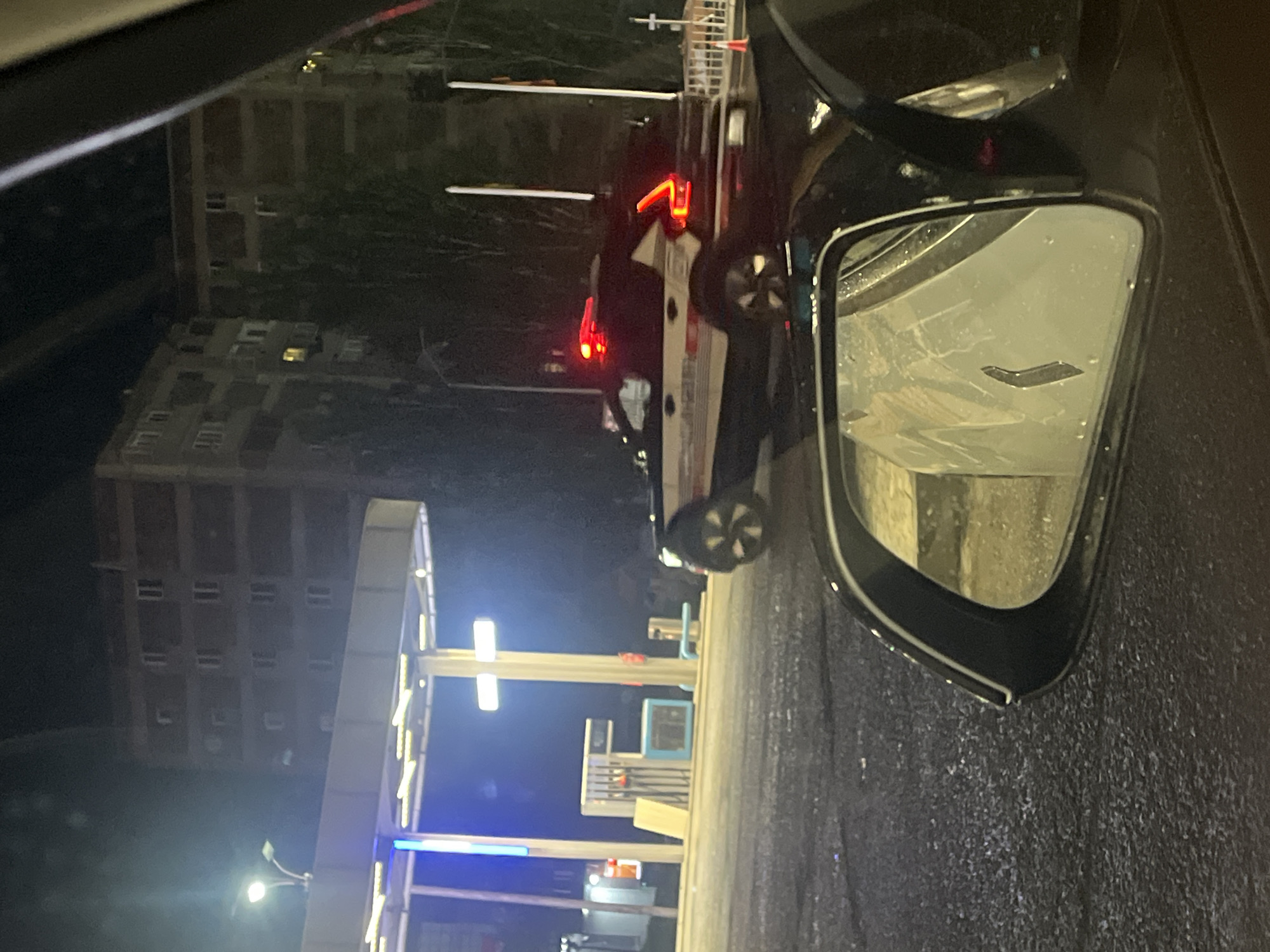 Nighttime vehicle scene documented on wet Yerevan street