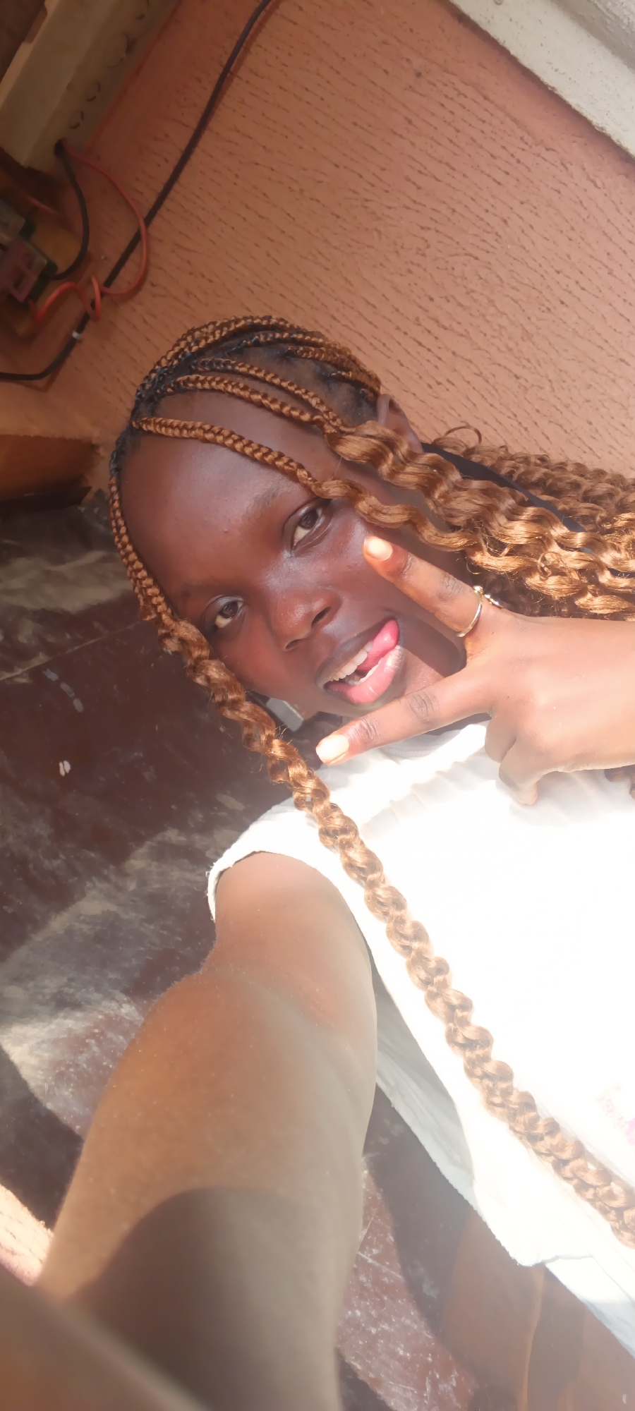 Young woman takes playful selfie session in Onitsha