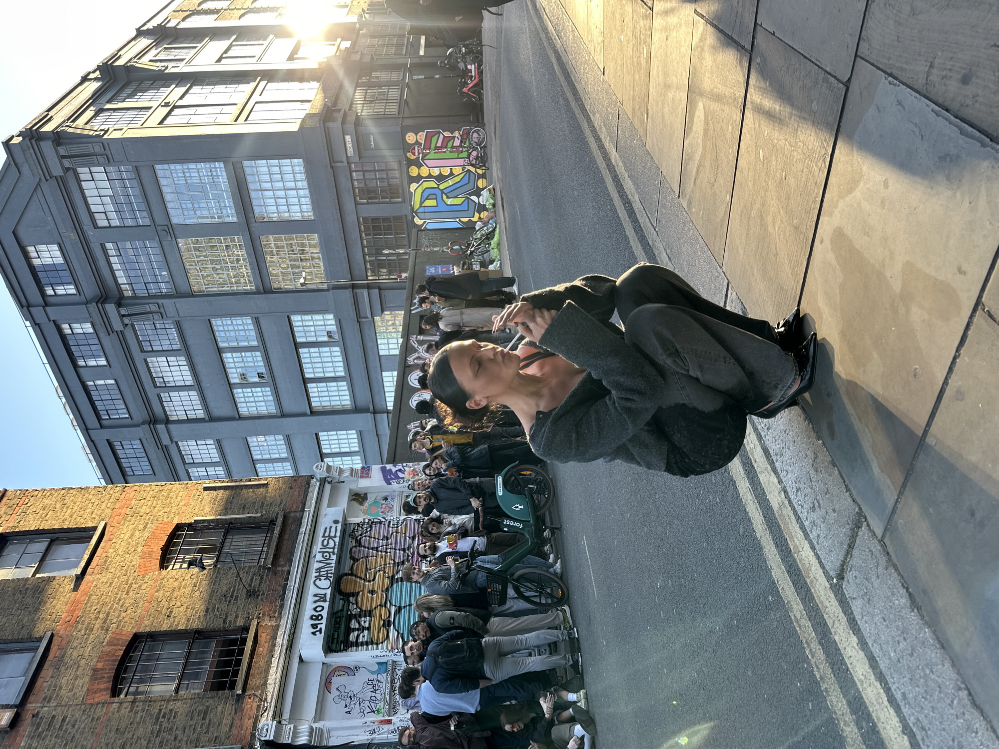 Woman photographed in various London locations during evening hours
