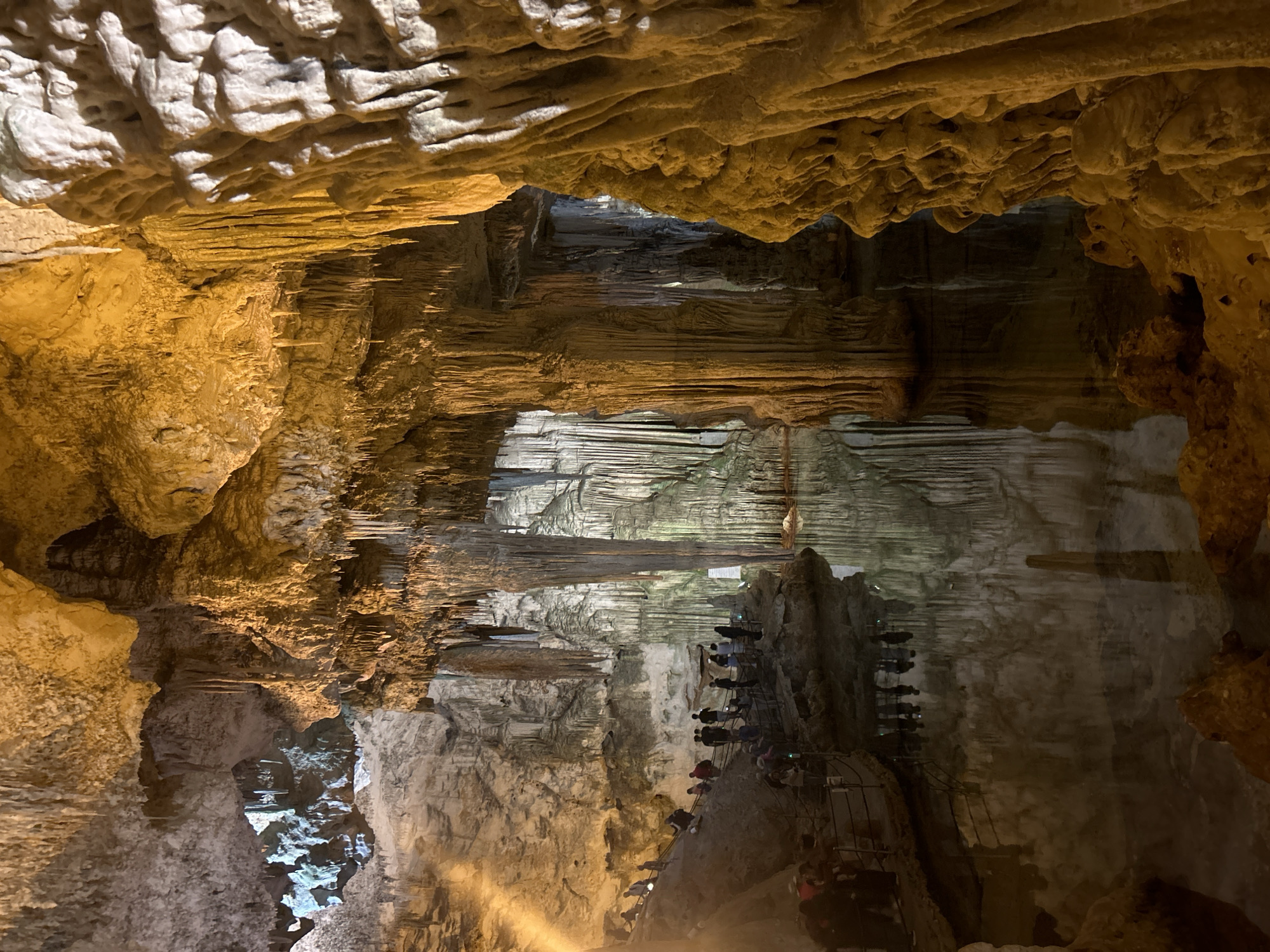 Tourists explore Neptune's Grotto cave system near Alghero, Italy