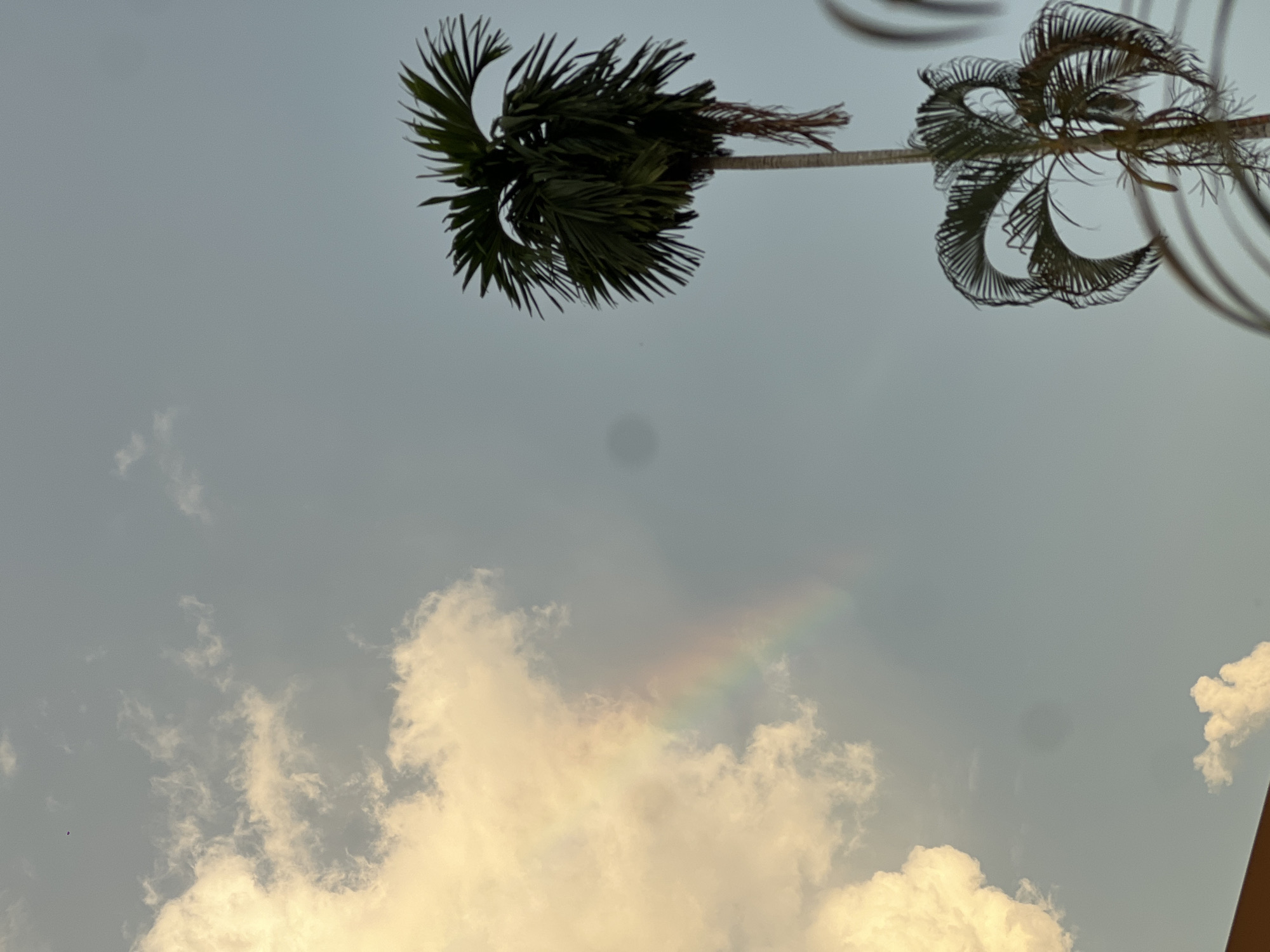 Golden clouds and partial rainbow observed in Si Sunthon