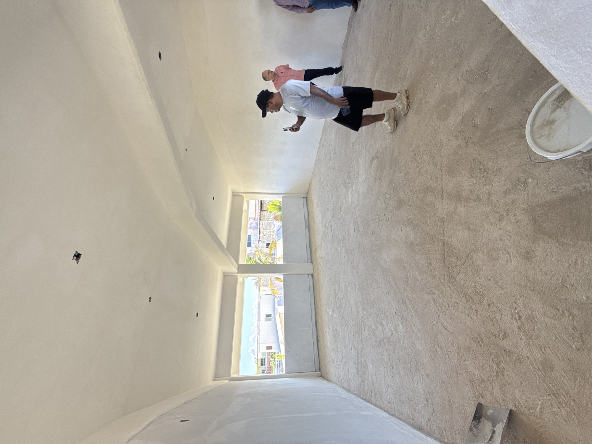 Construction workers renovate multi-story building in Acapulco