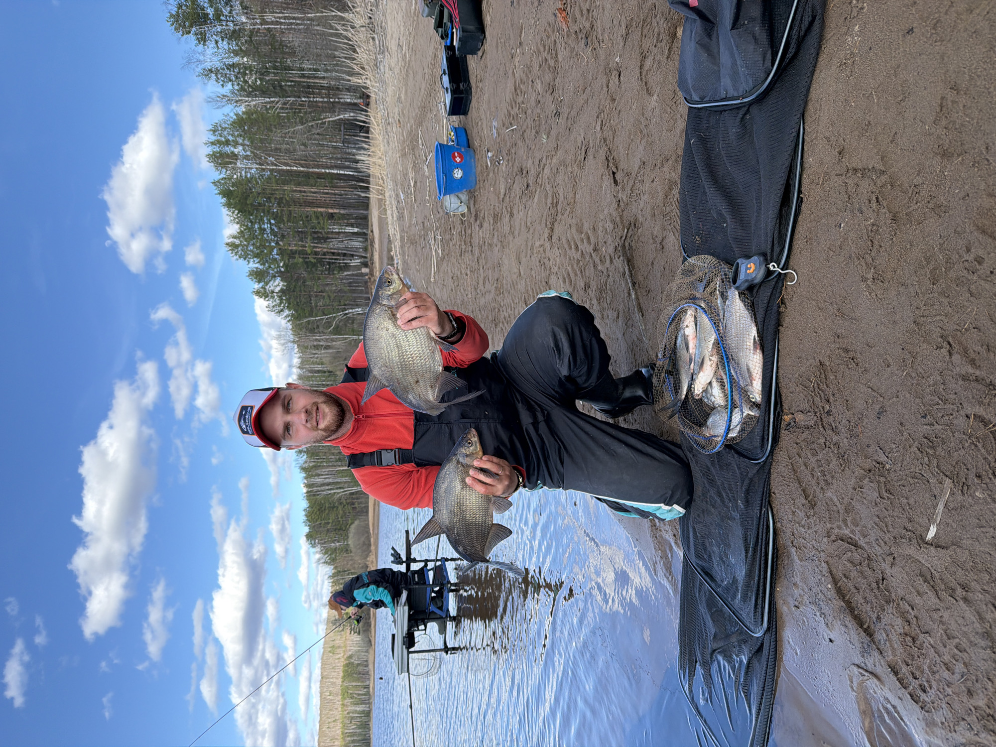 Fishermen land catch along Chaykovsky shoreline