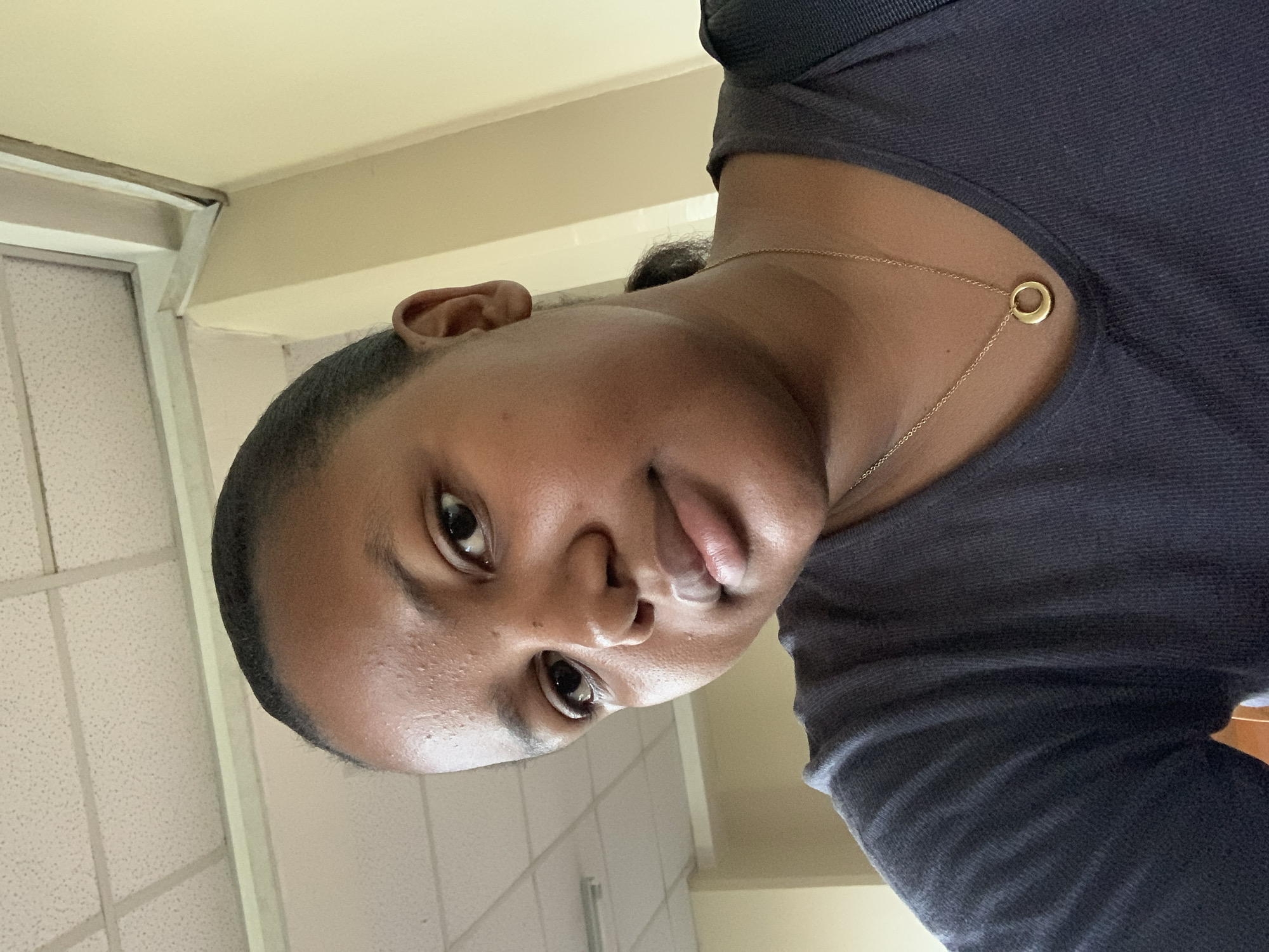 Person takes selfies and venue photos in Dar es-Salaam auditorium