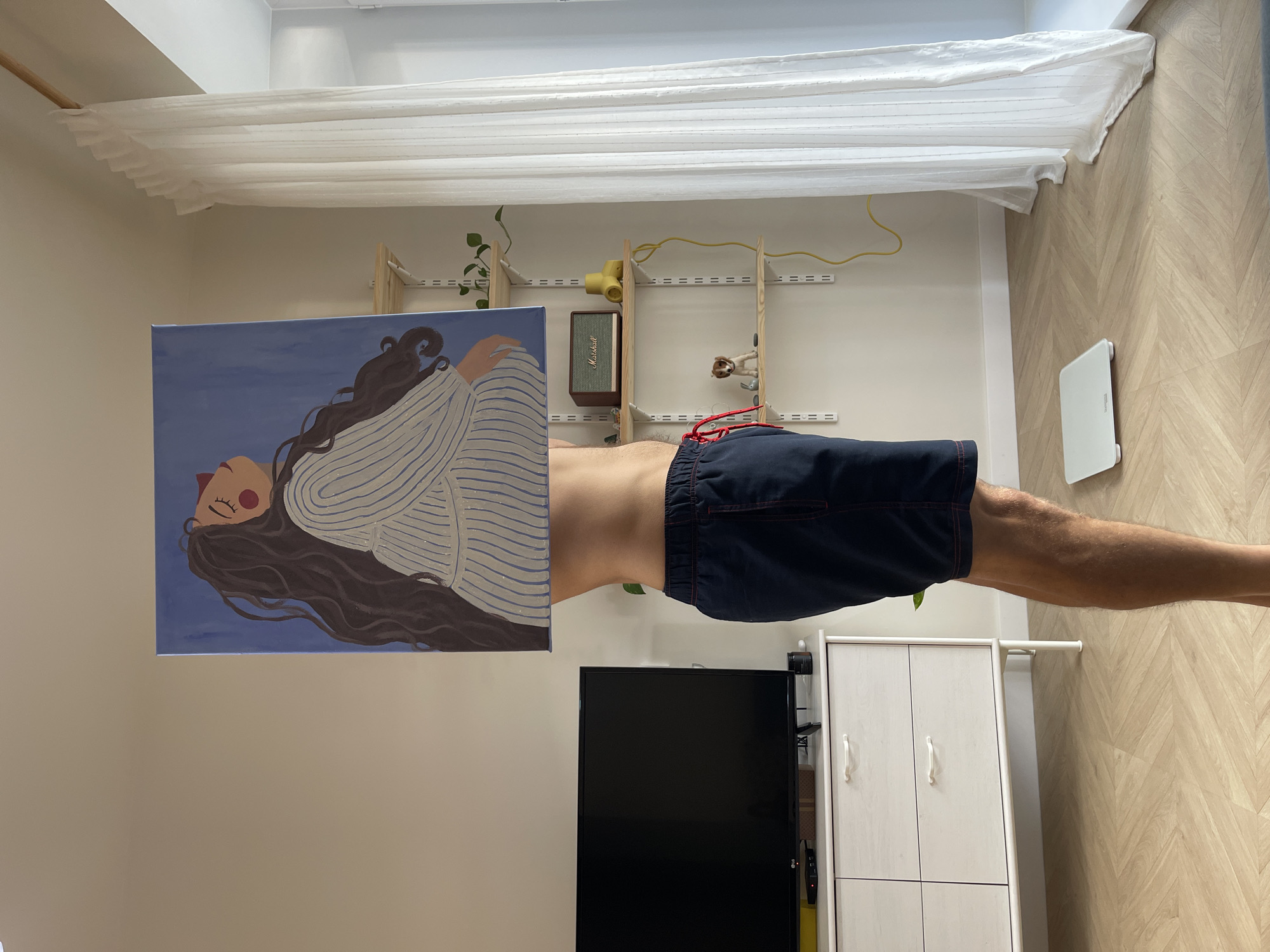 Person with painting observed in furnished room