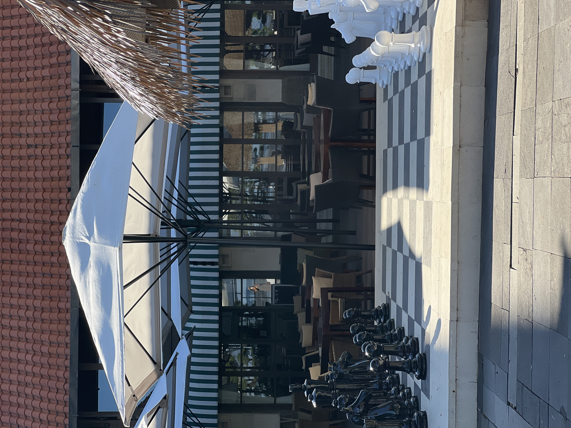 Morning scenes captured across Denpasar including chess set, beach, resort