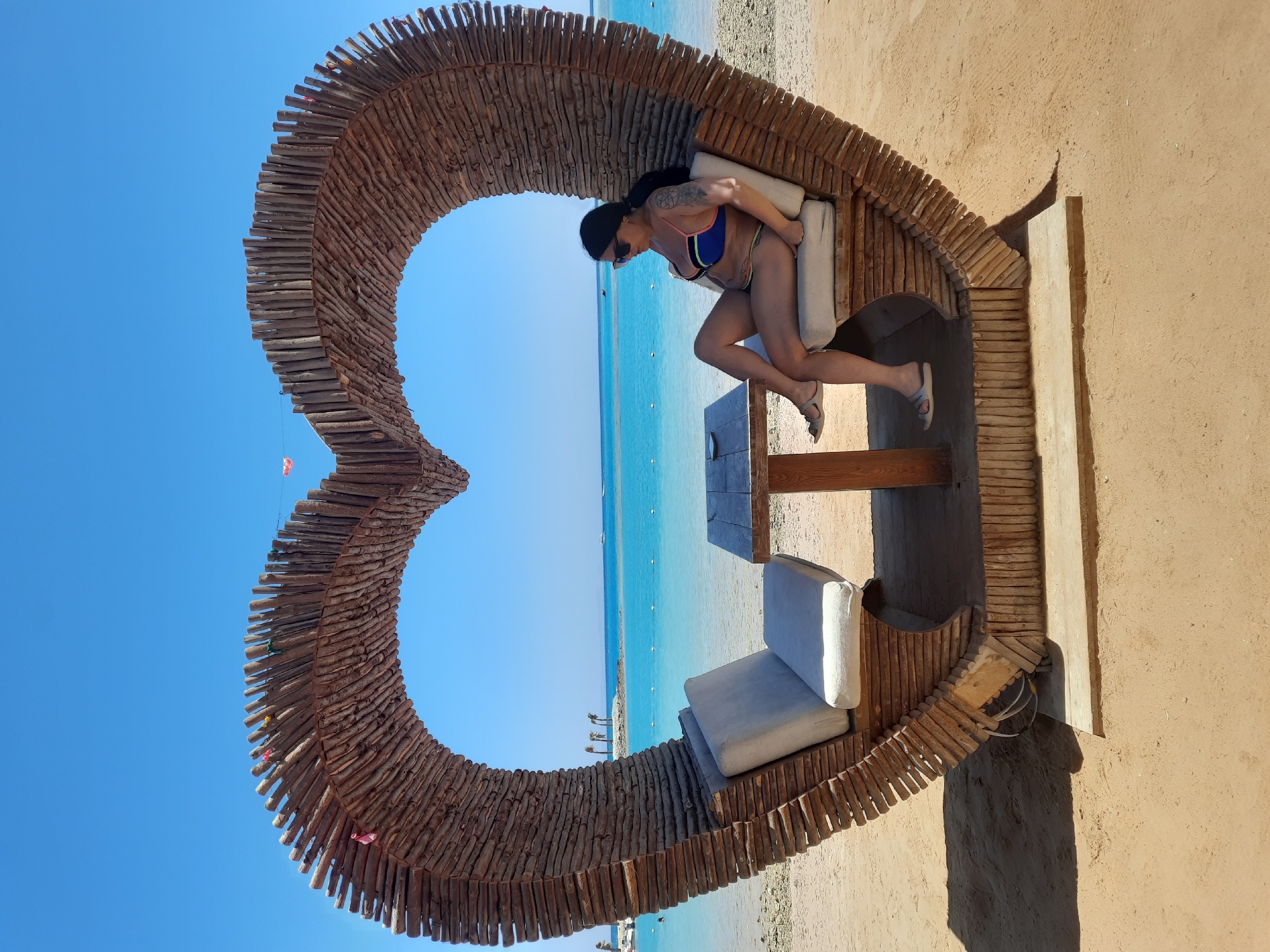 Woman enjoys morning beach photo session in Hurghada