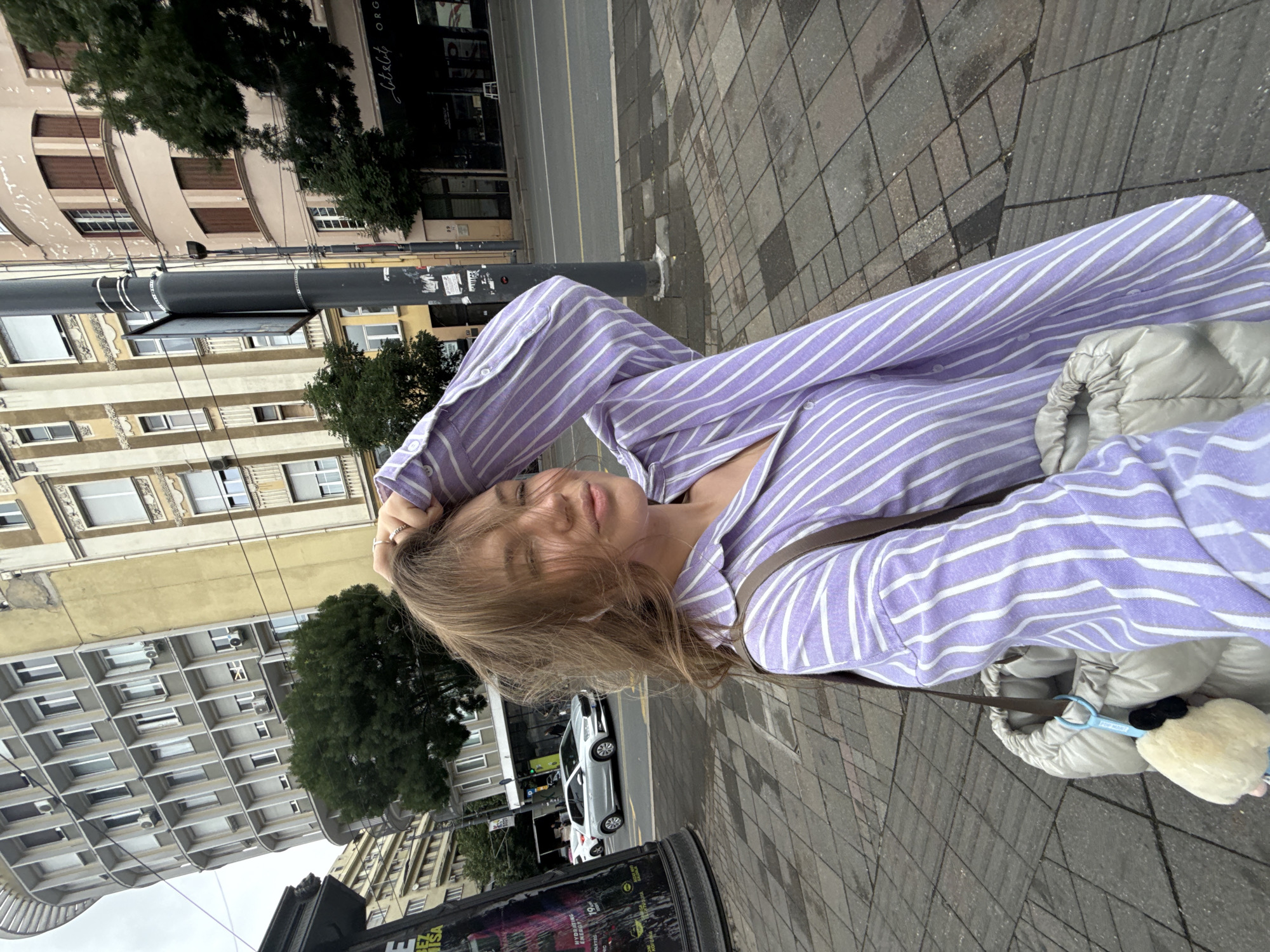 Woman takes selfie on Belgrade street Thursday morning