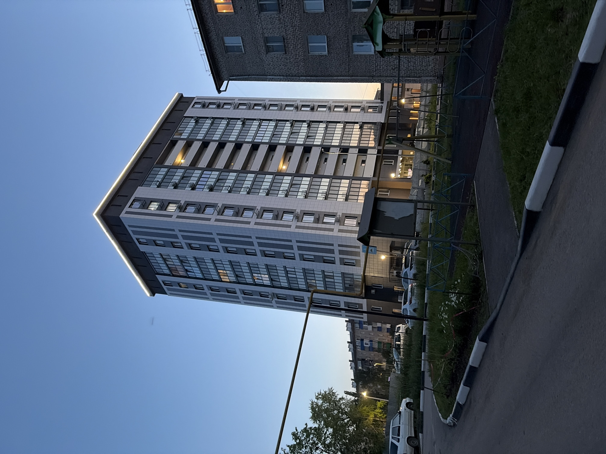Dusk scenes of modern apartment buildings observed in Tujmazy