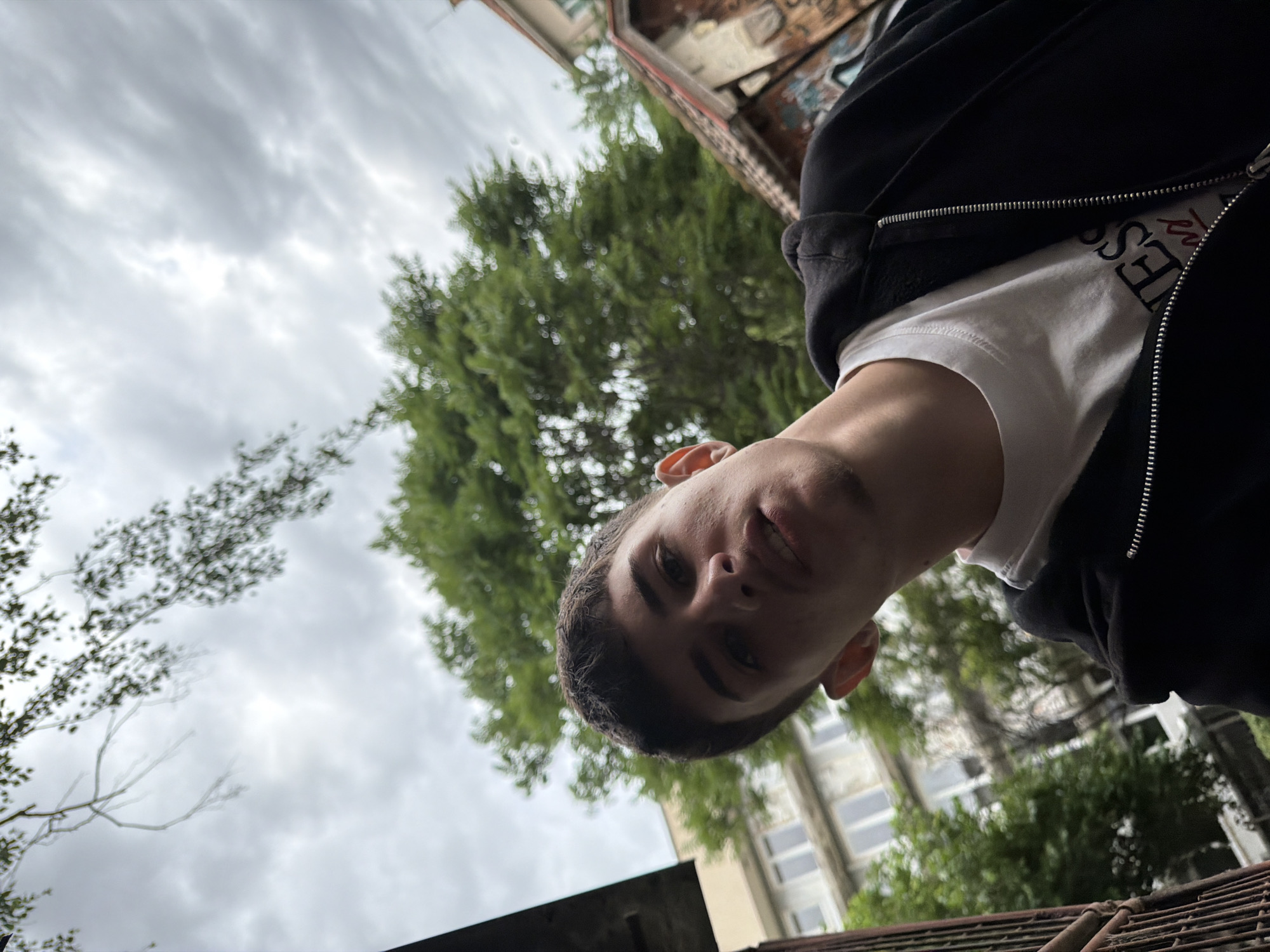 Young people gather on Plovdiv sidewalk in casual morning meetup