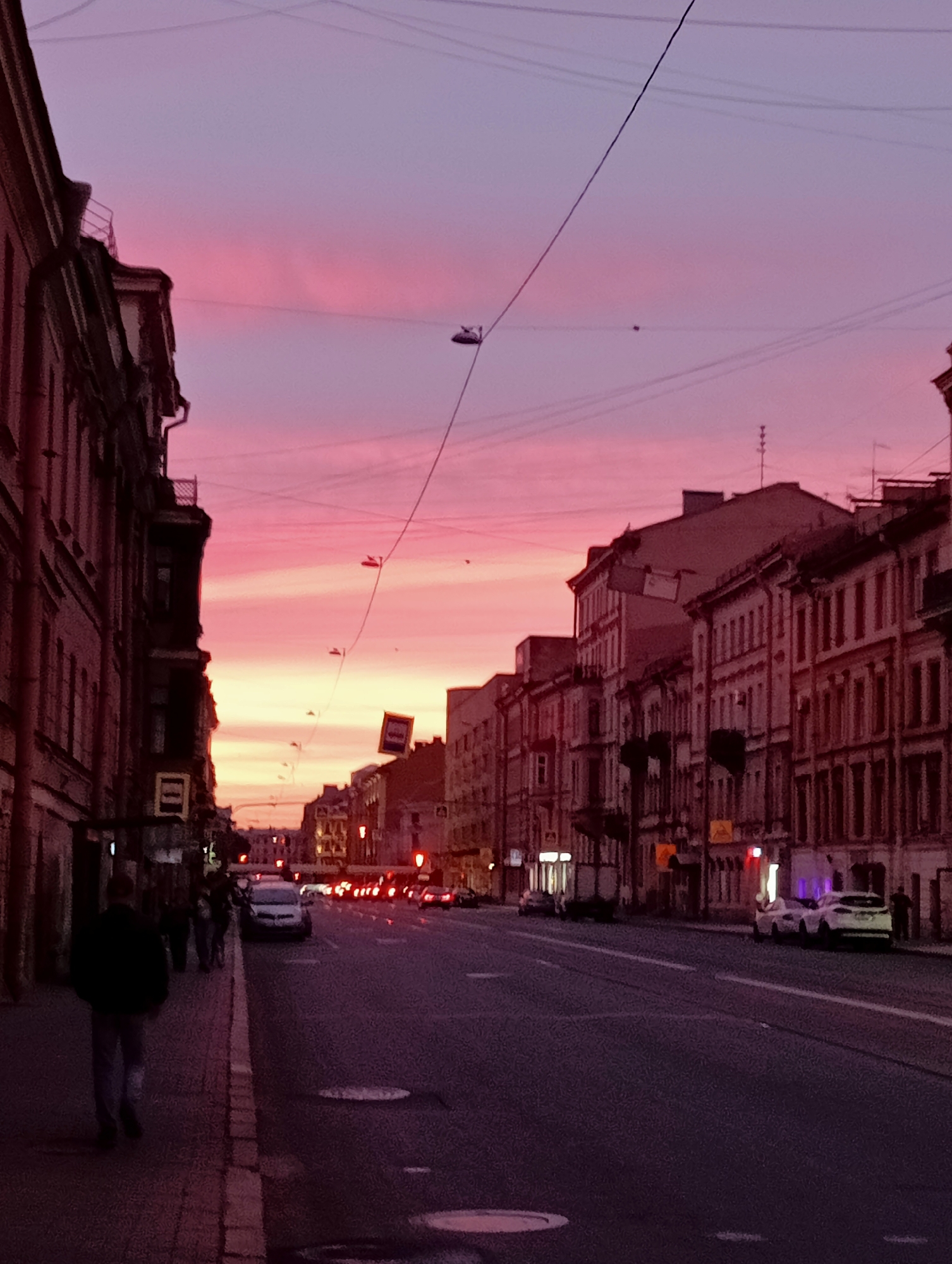 Saint Petersburg glows pink at dusk during a summer evening