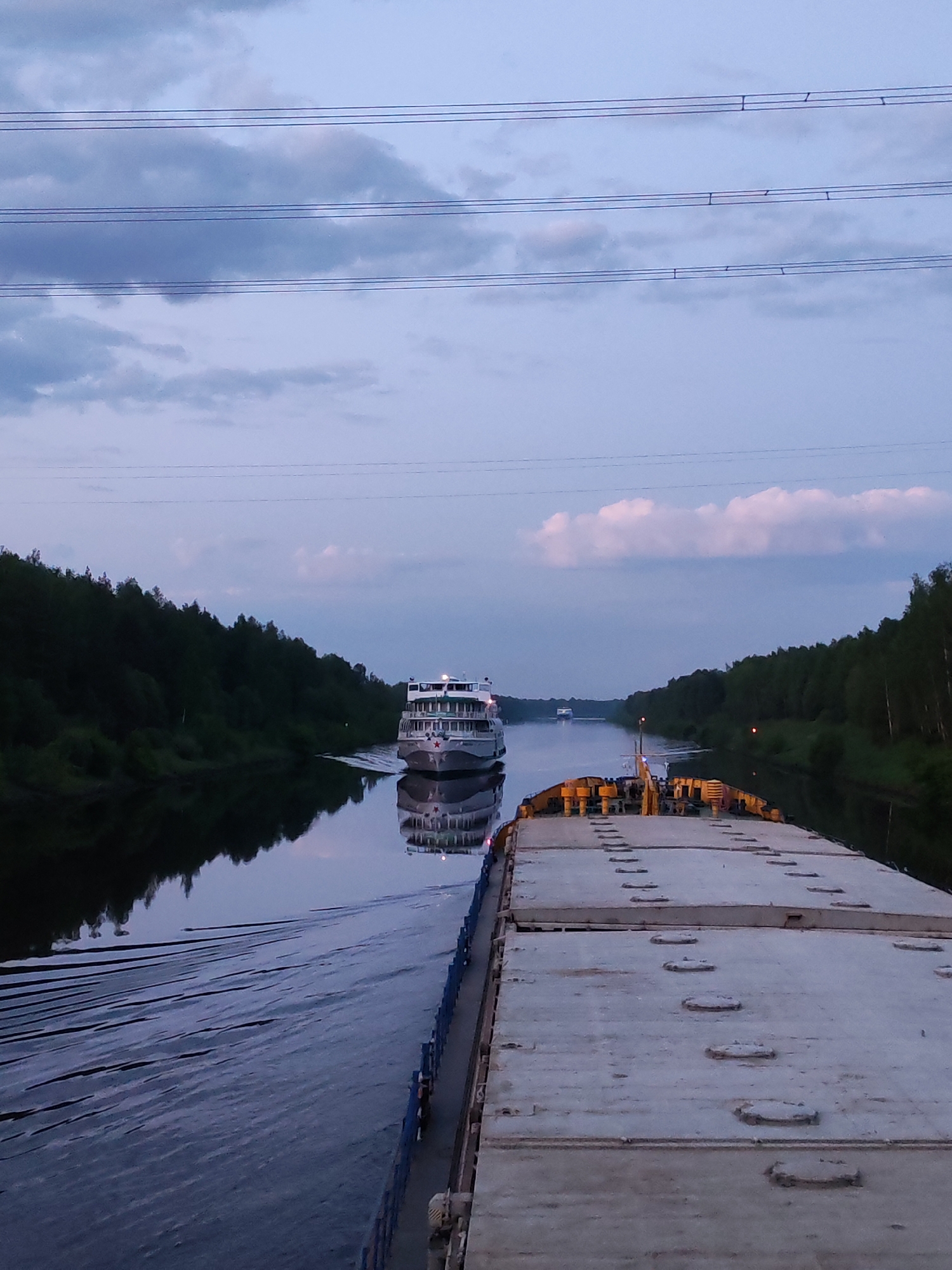 River vessels navigate Zaprudnya waterways during early morning hours
