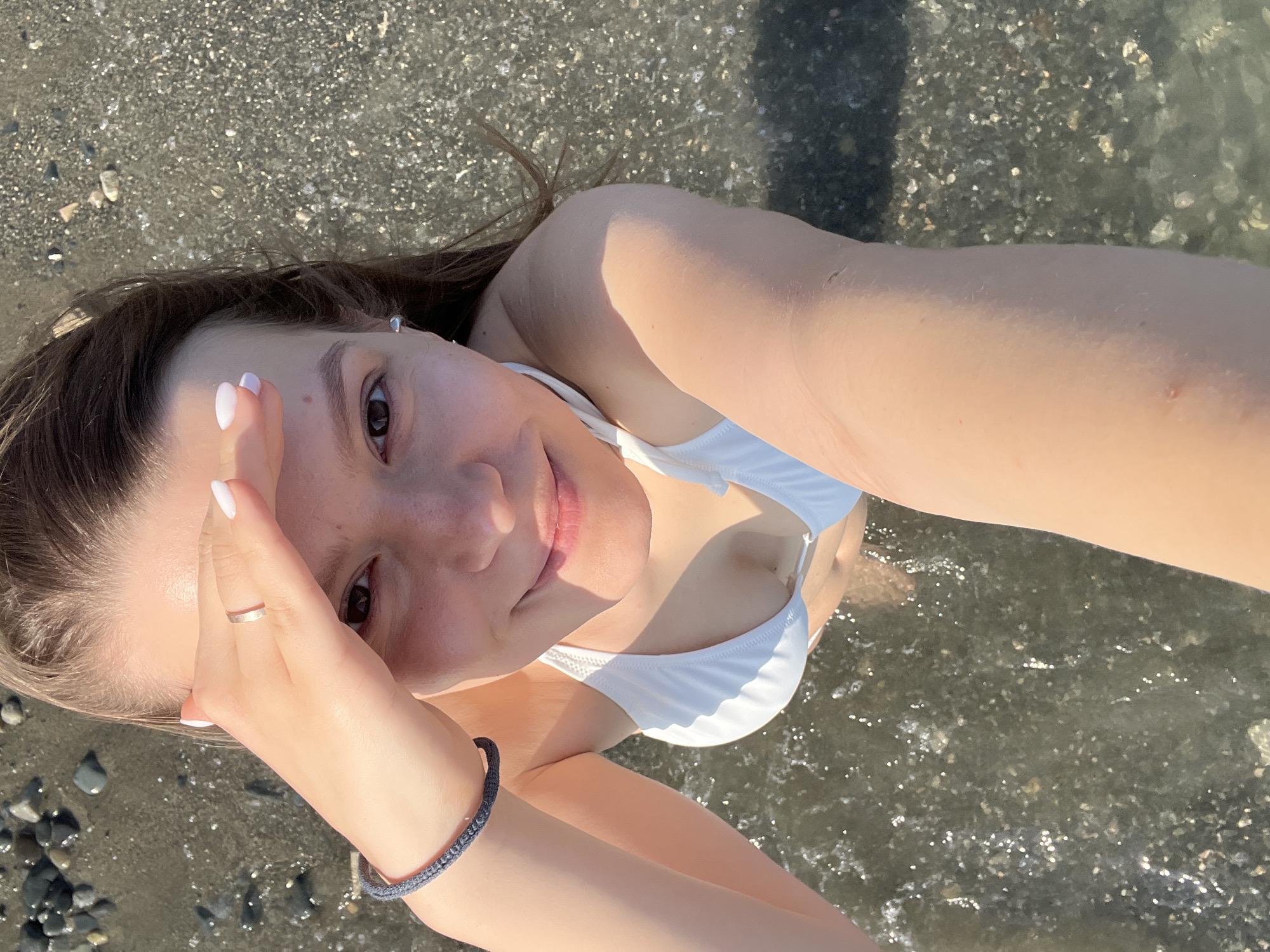 Woman enjoys beach day in Cyprus, takes selfies