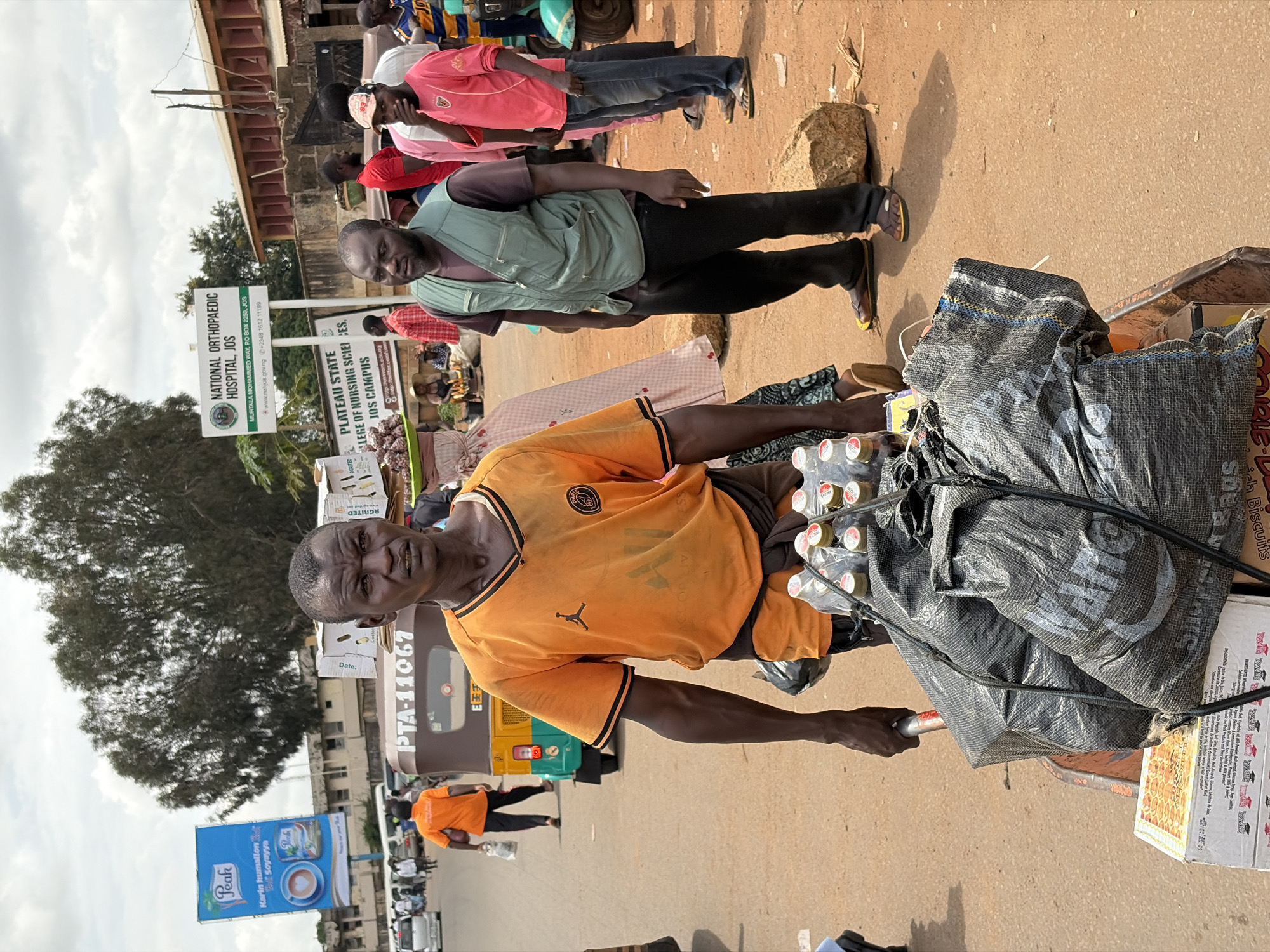 Everyday street life moving through Jos, Nigeria