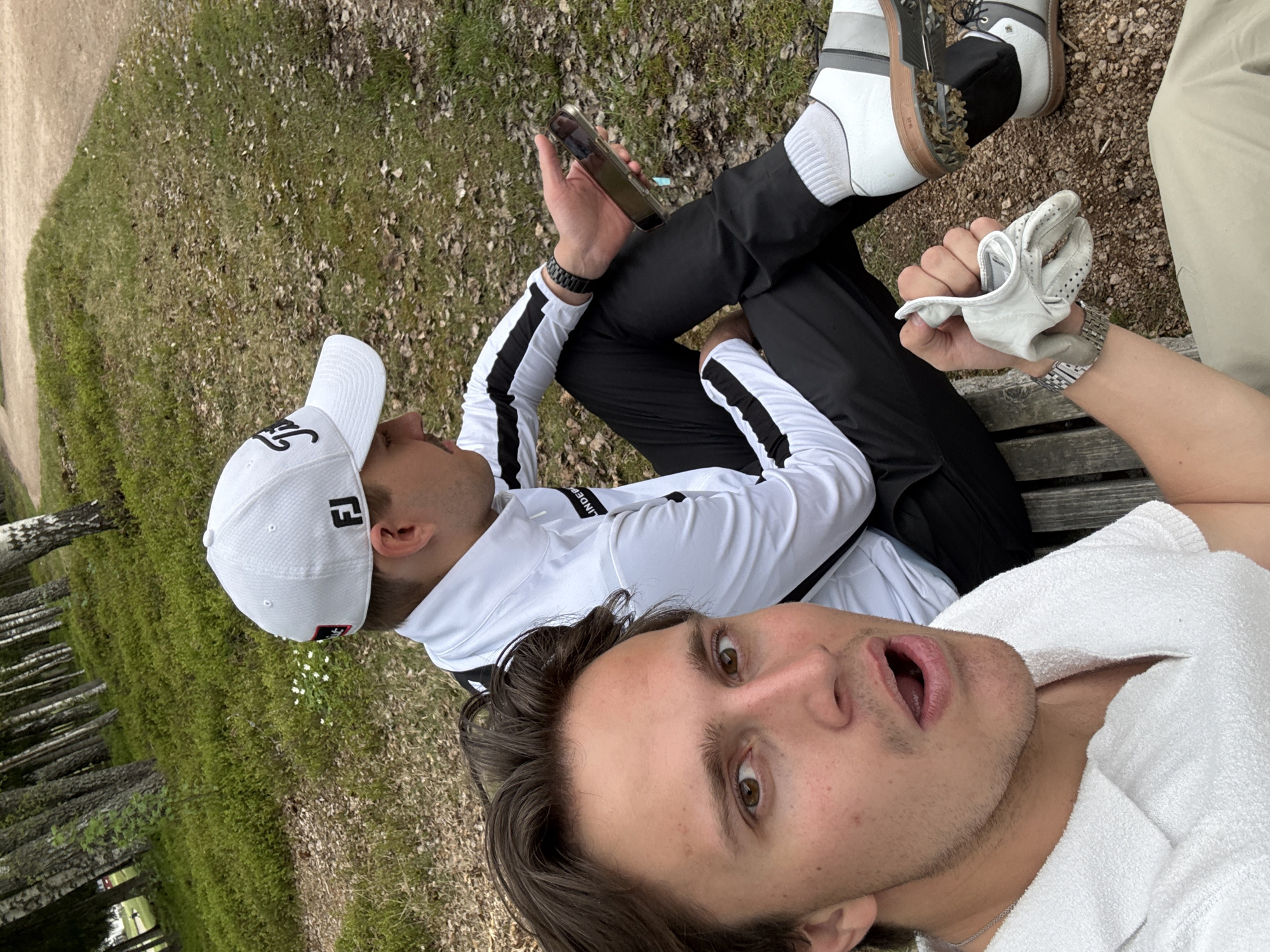 Two men spotted on bench in Sylling, one surprised