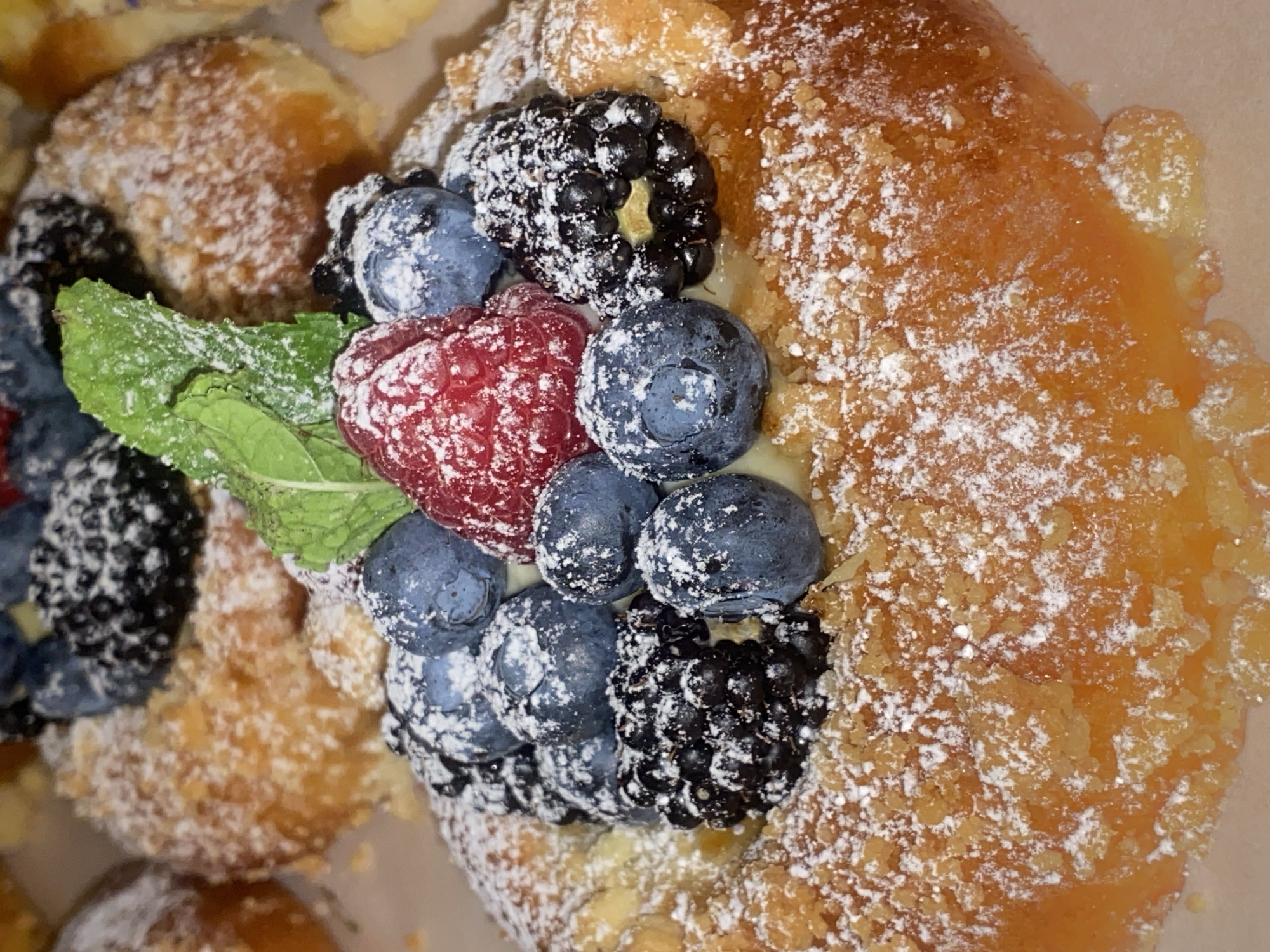 Warsaw café pastries and elaborate mythological murals, midday