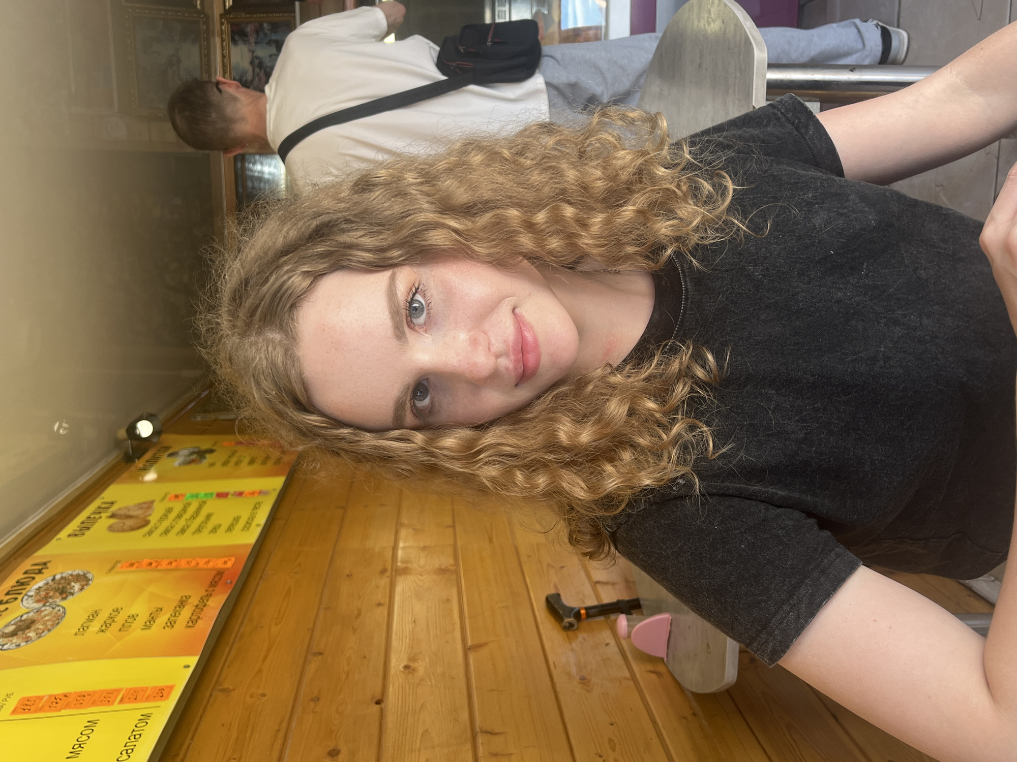 Woman takes selfie at table in Vasilyevo, Russia