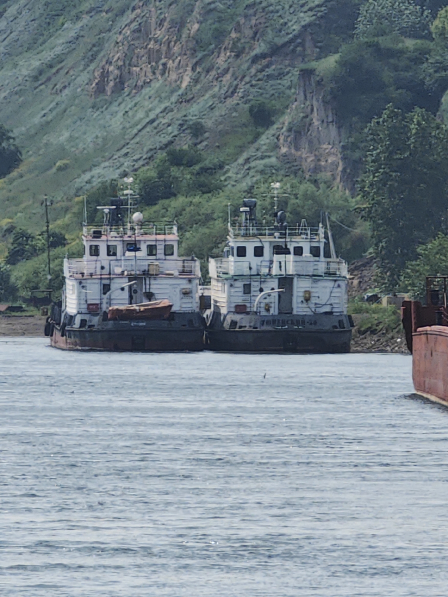 Morning on the Yenisei: river vessels, bridge controls, and Krasnoyarsk waterfront
