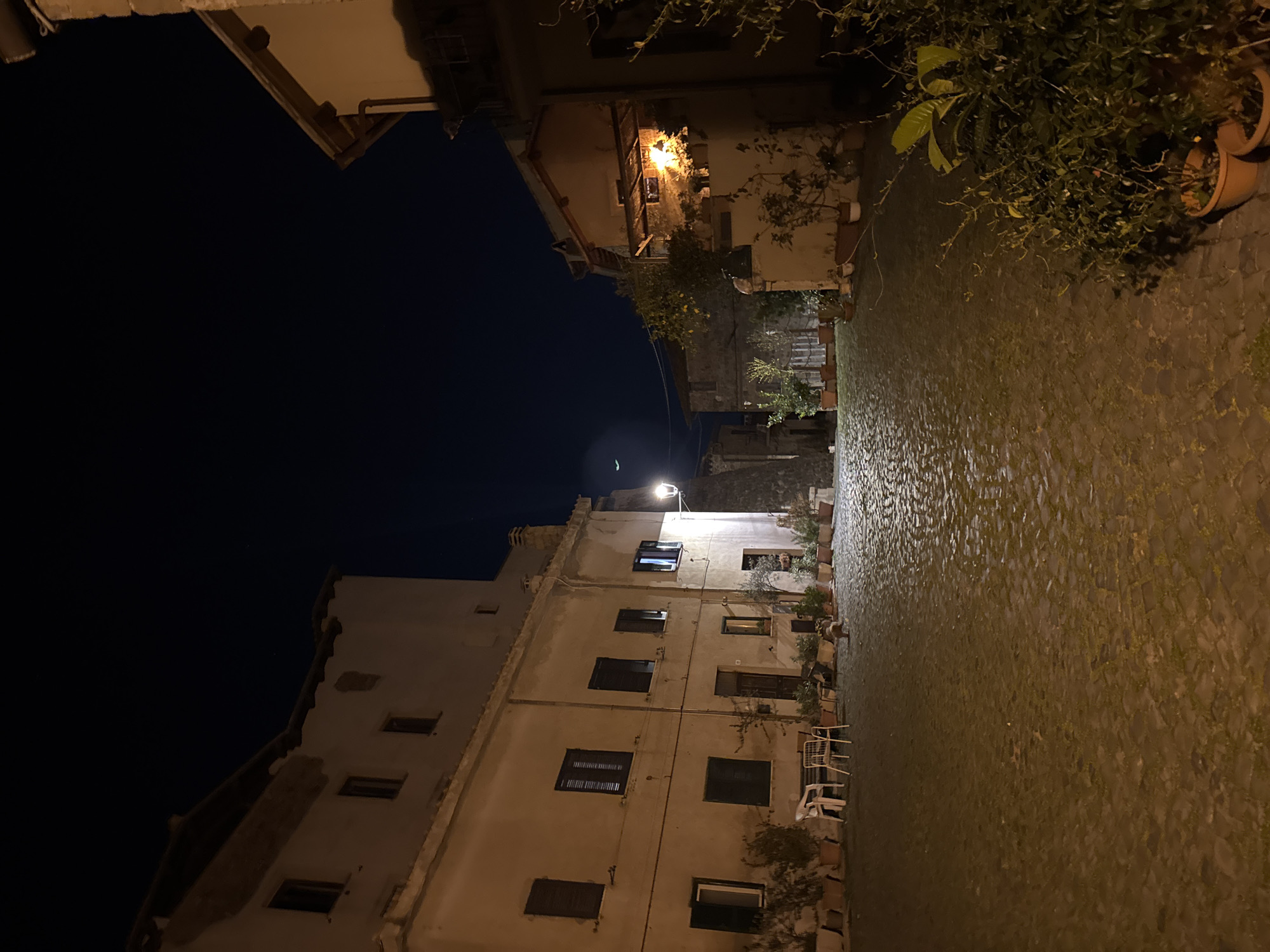 Evening life captured in historic Italian town square