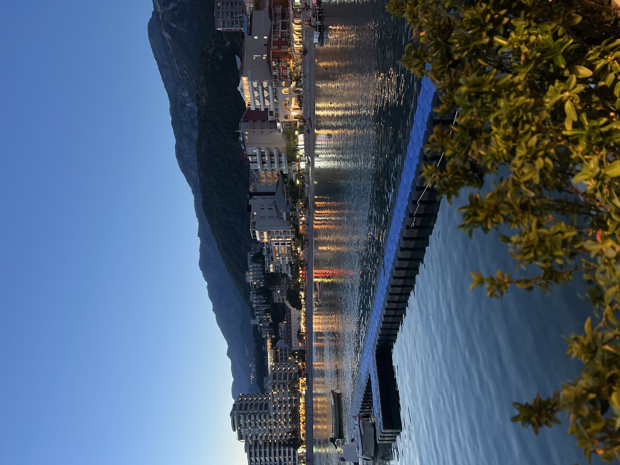 Evening khachapuri dinner shared at Montenegro waterfront during dusk