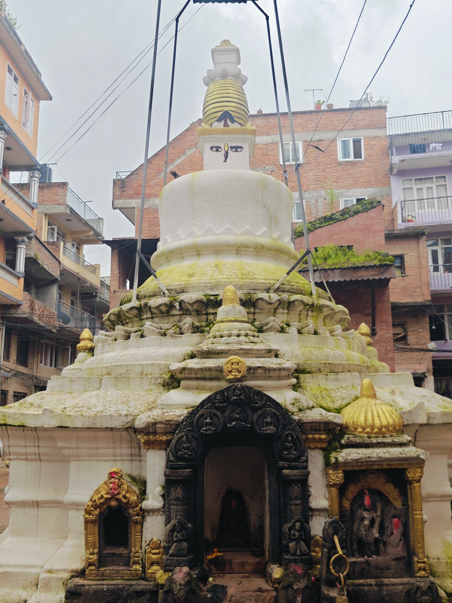 Morning scenes from Kirtipur's old brick streets and temples