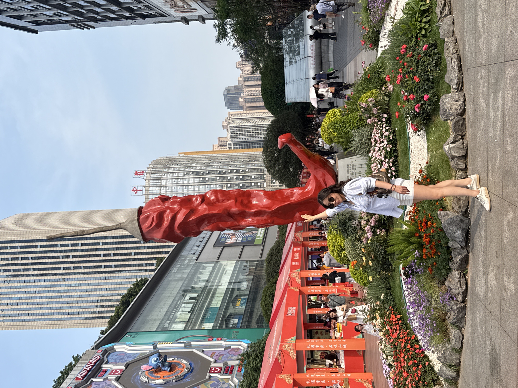 Morning activities captured around chili pepper statue in Liangjiang