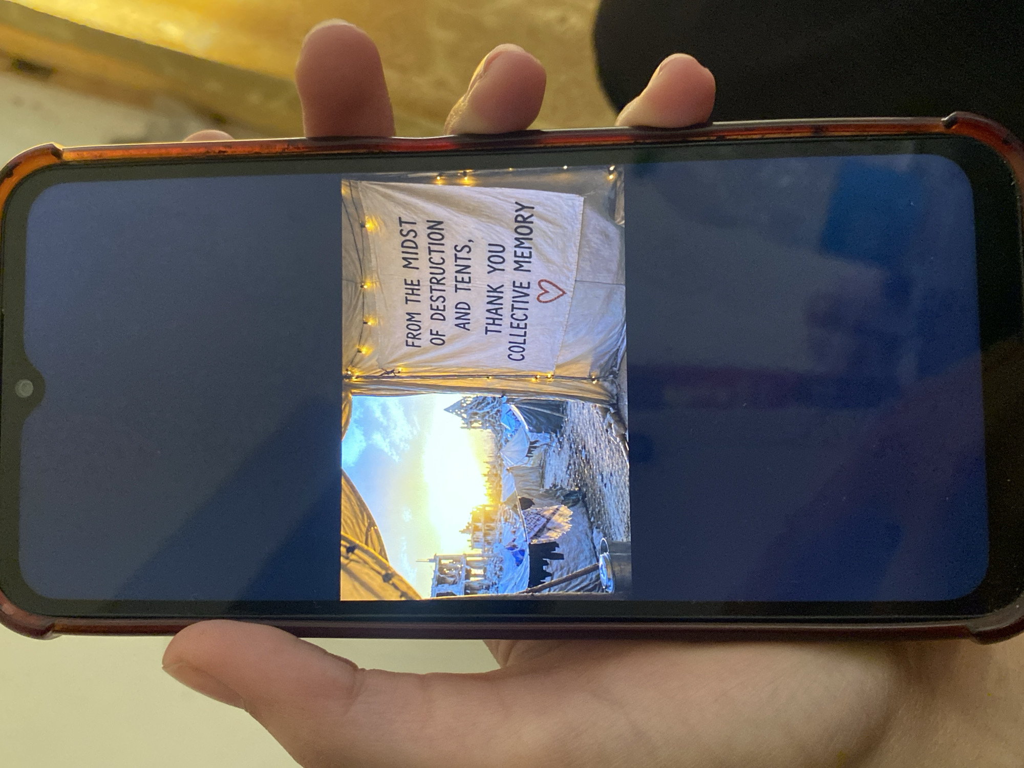 Person views rotated photo on smartphone in Larnaca