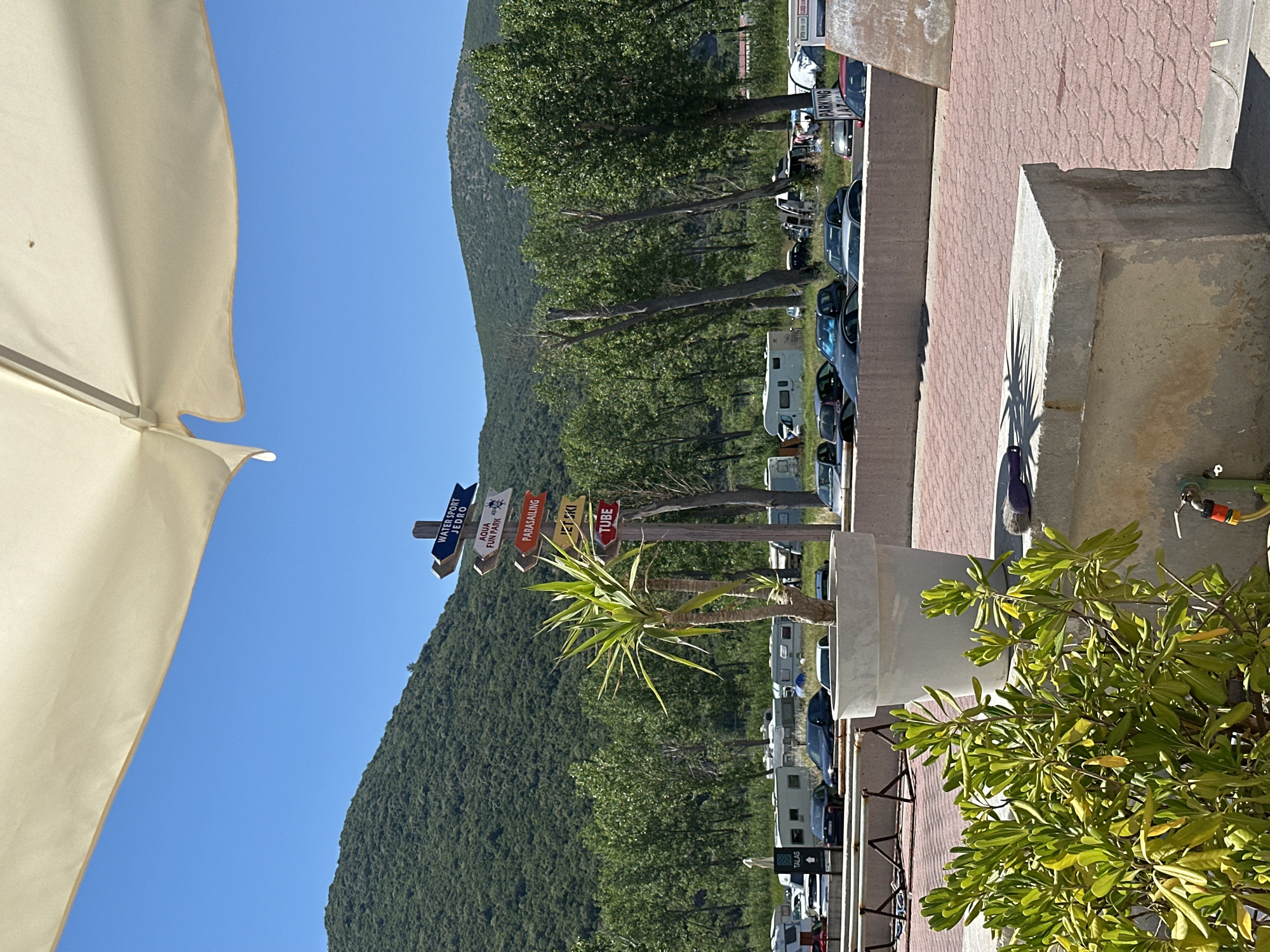 Busy summer afternoon on a Montenegrin Adriatic pebble beach