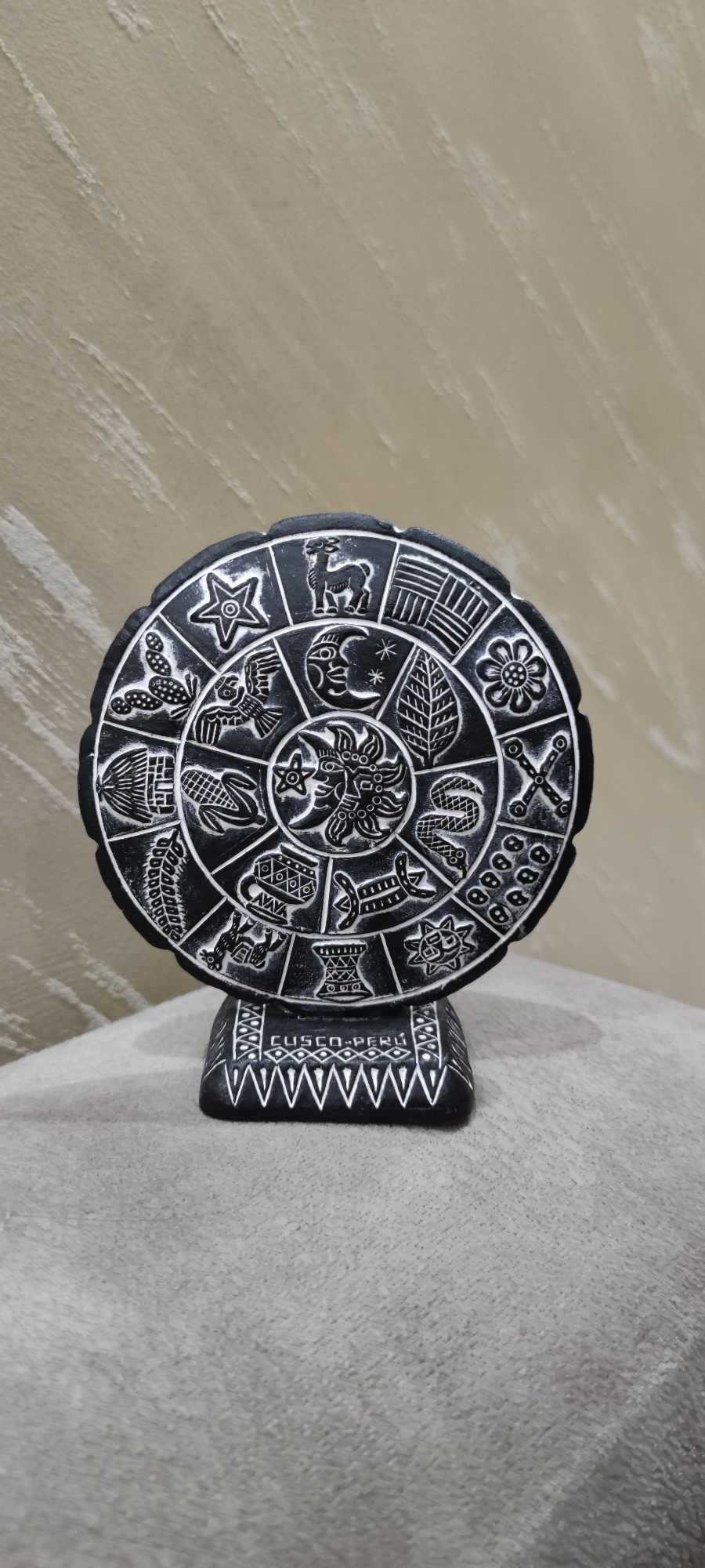 Artifacts documented in Yerevan including engraved stone, light fixture