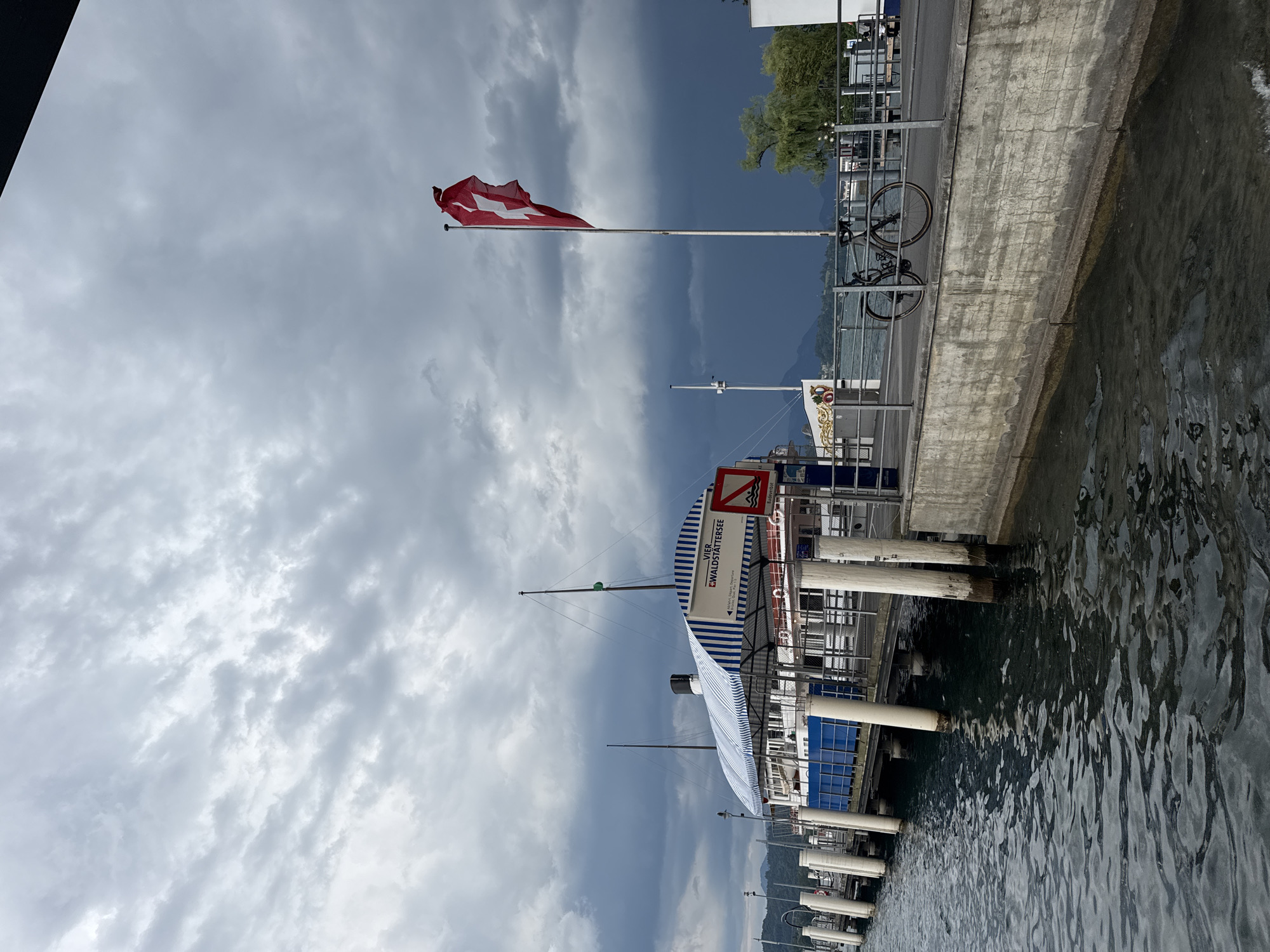 Storm clouds gather over Lucerne's lakefront as ferry sits docked
