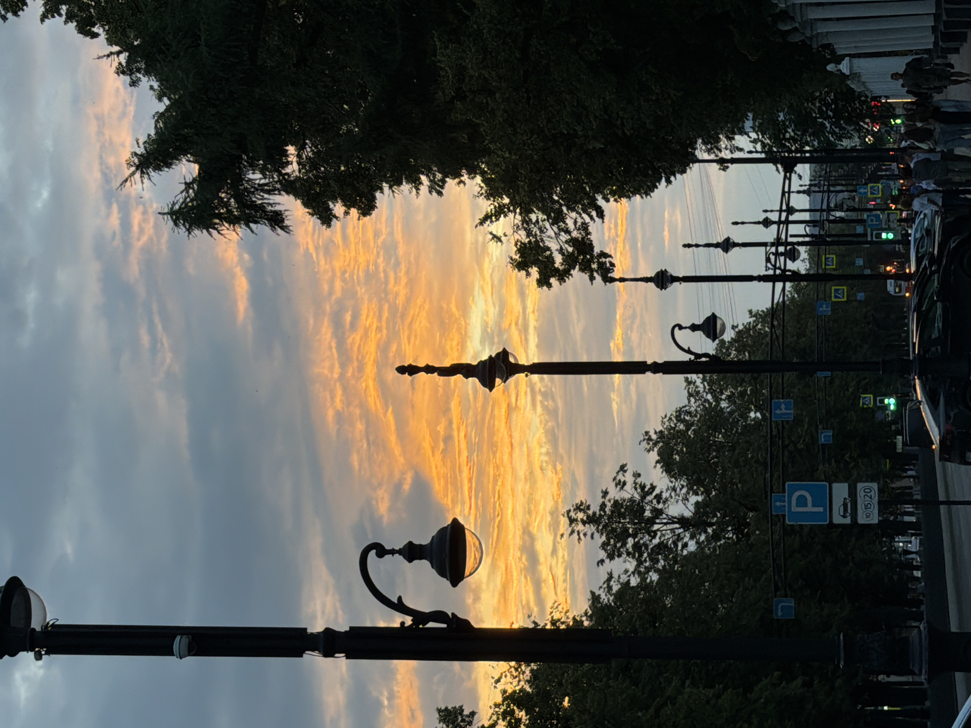 Perm amusement park at dusk, rides lighting up for the night