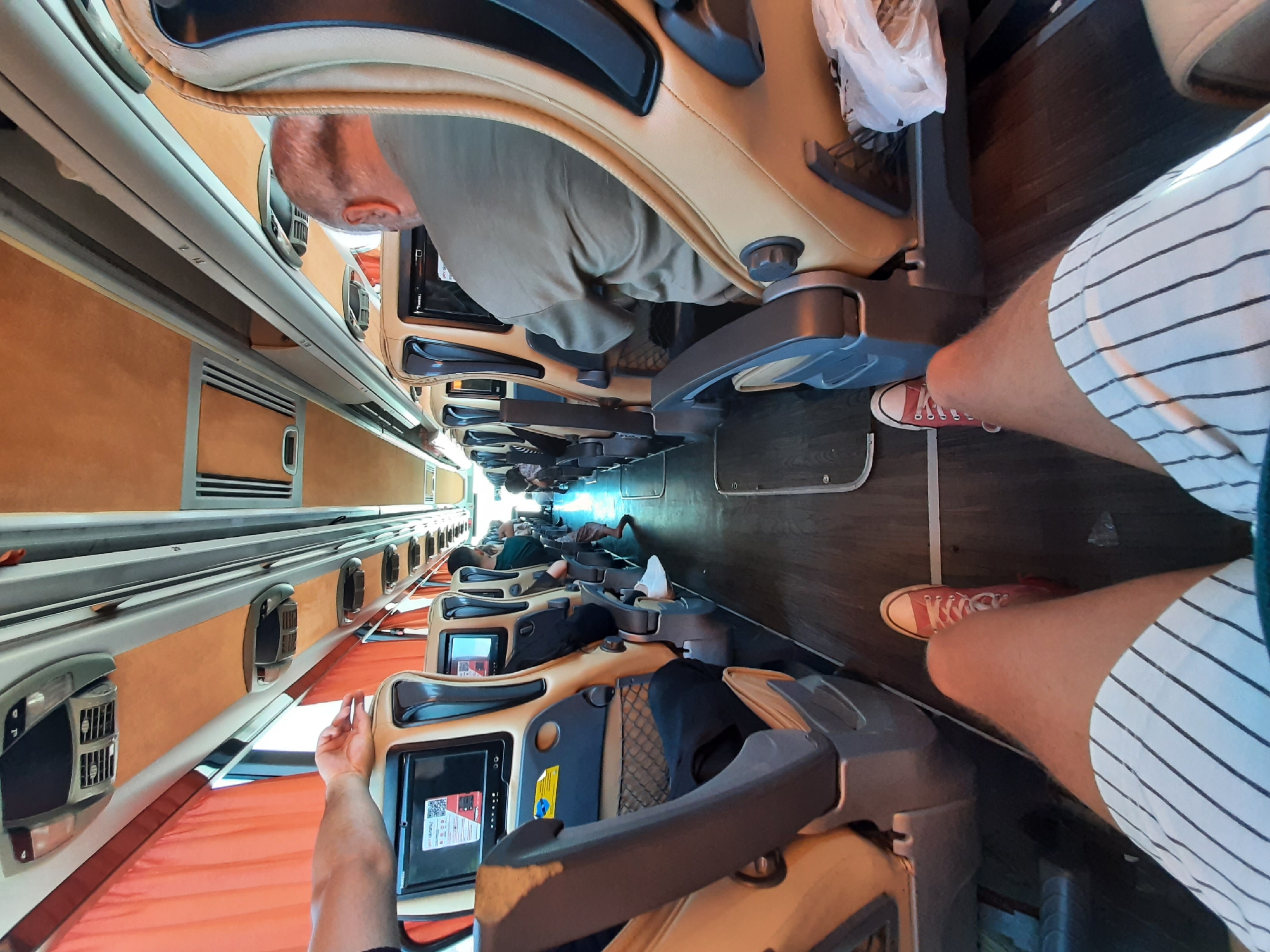 Passengers rest in reclined seats on a Turkish sleeper bus