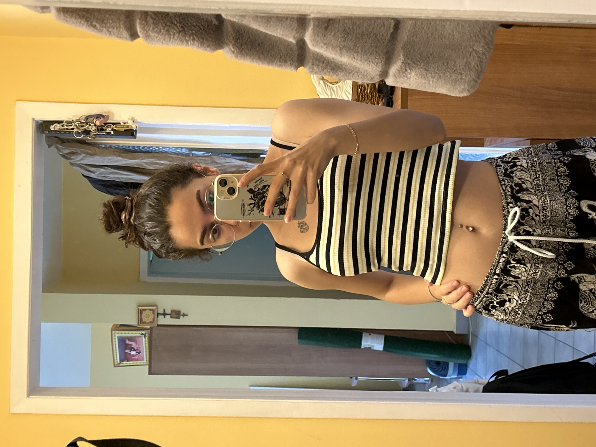 Mirror selfie session in a yellow-walled room, Sofia