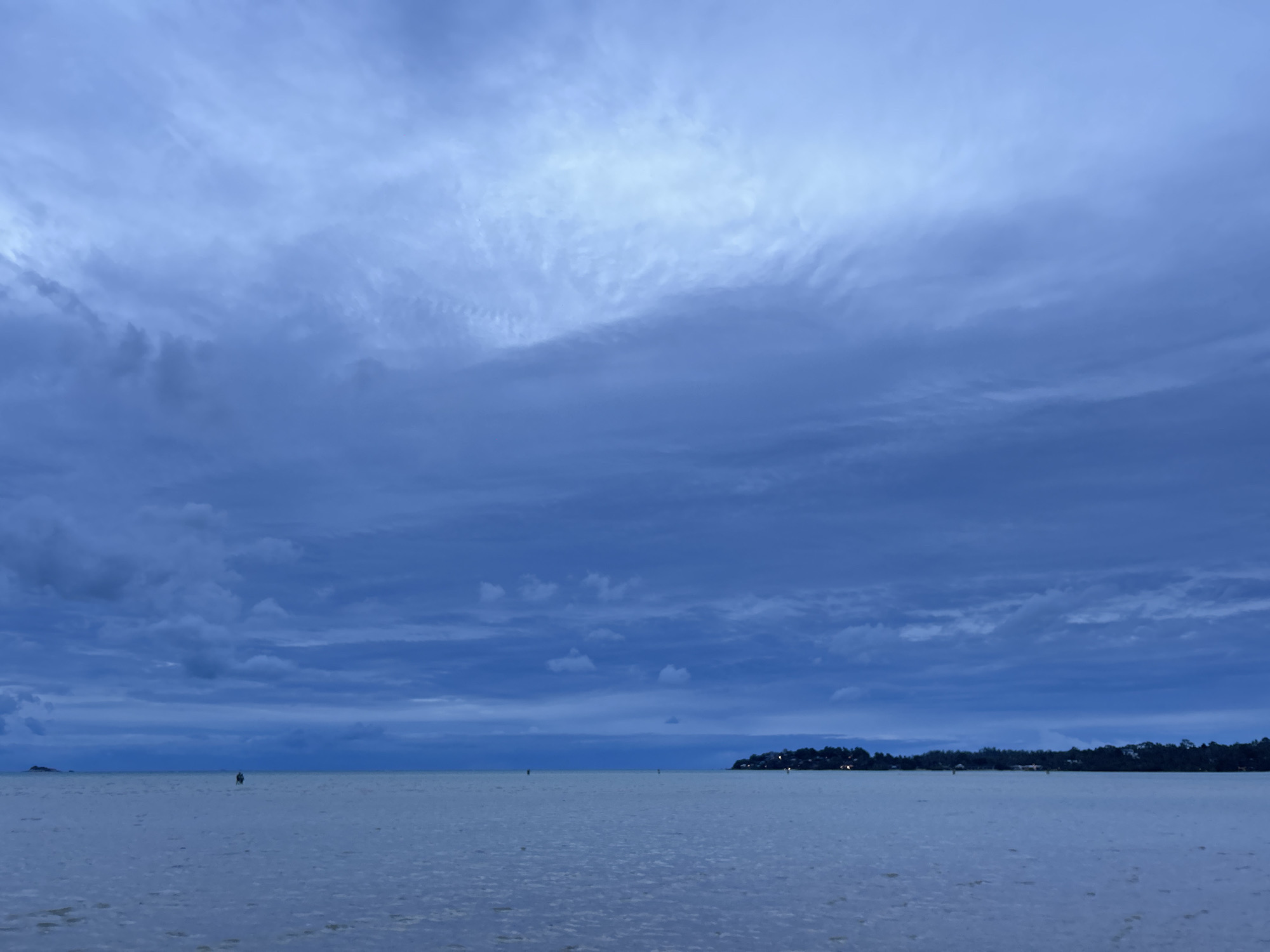 Overcast morning on Ko Pha-ngan's rocky, tidal shoreline