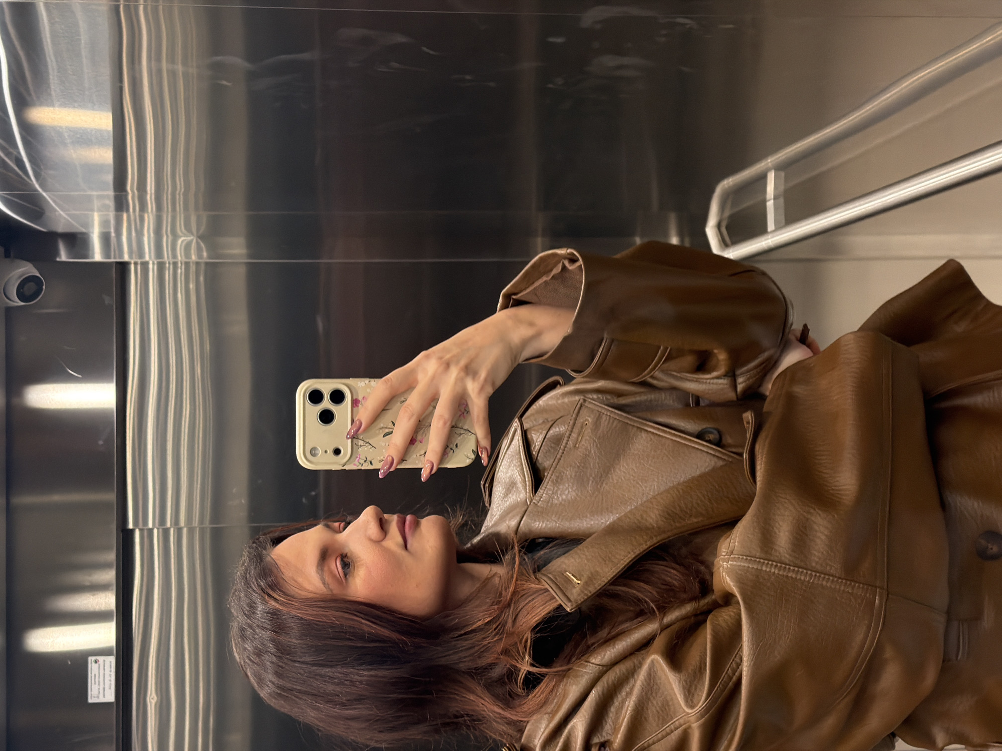Woman takes elevator selfie in Belgrade