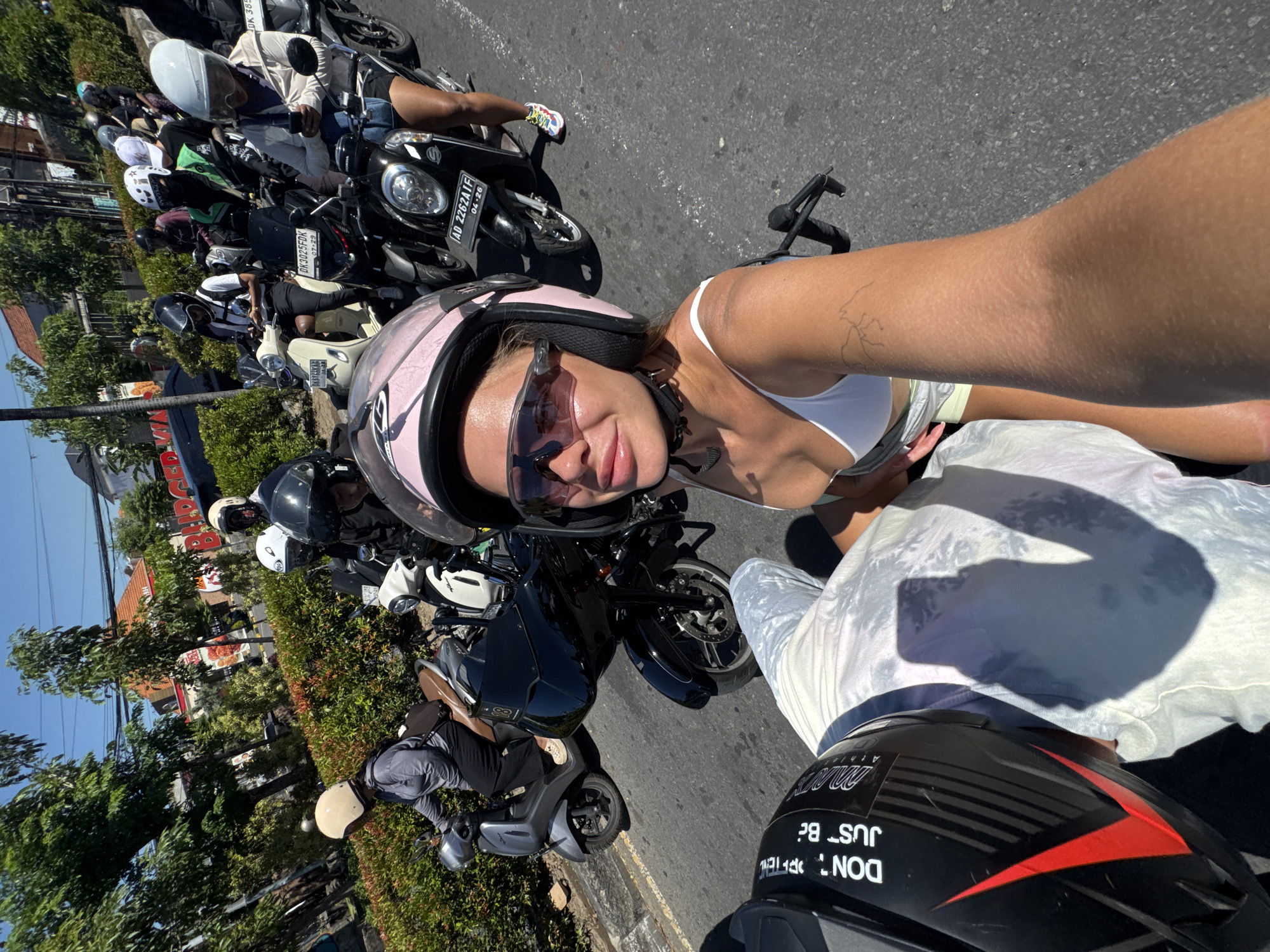 Heavy motorcycle traffic jam captured in Denpasar streets