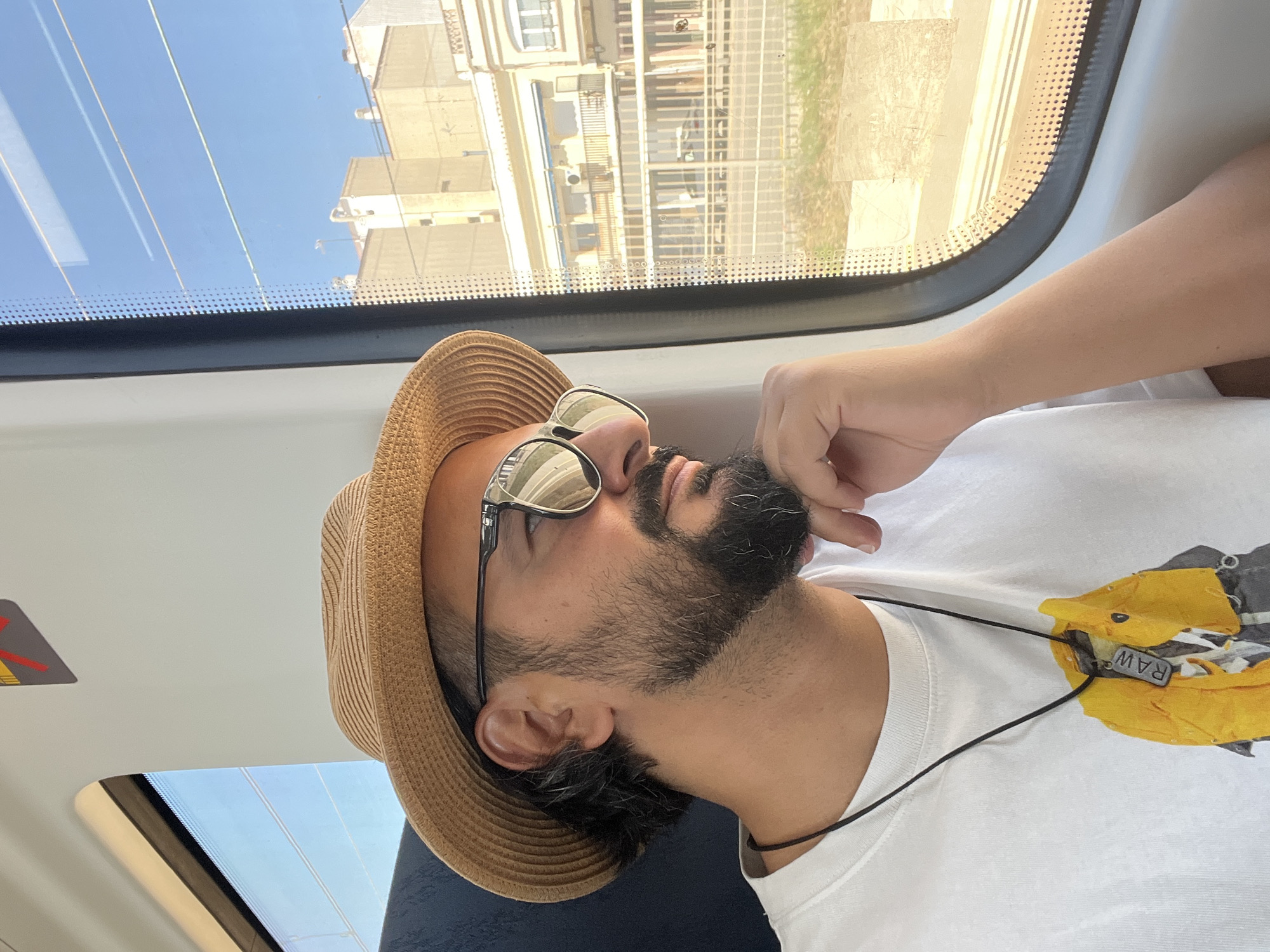 Train passenger rests during journey in Premià de Mar