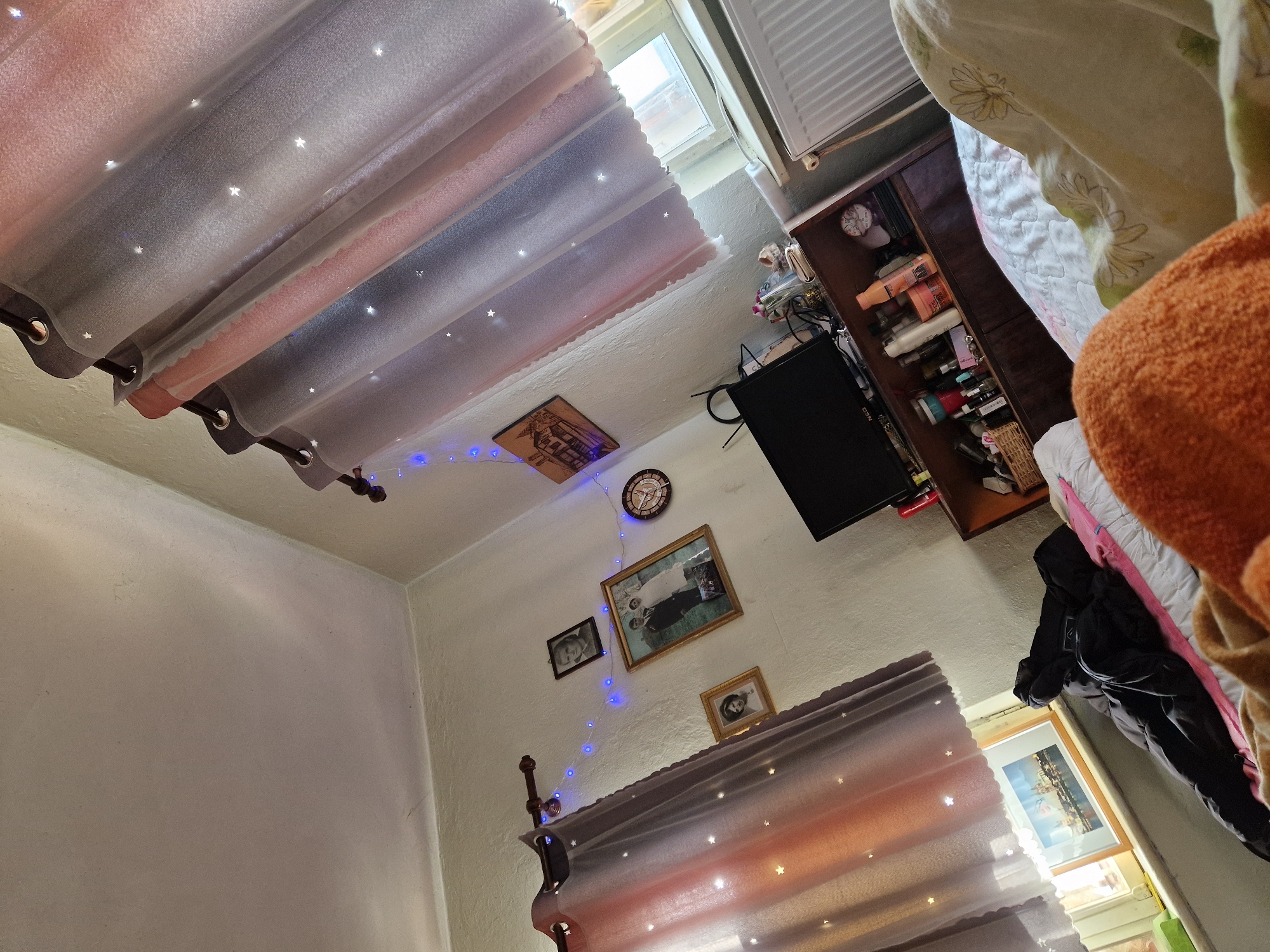 Dawn interior scene captured in Bulgarian bedroom with starlight curtain