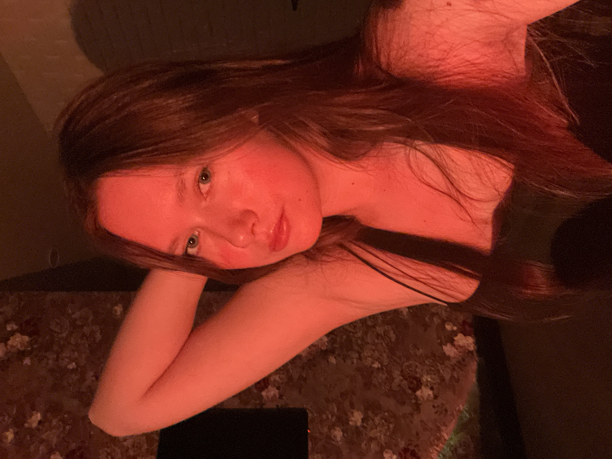 Evening portraits captured under red lighting in Chaikovsky