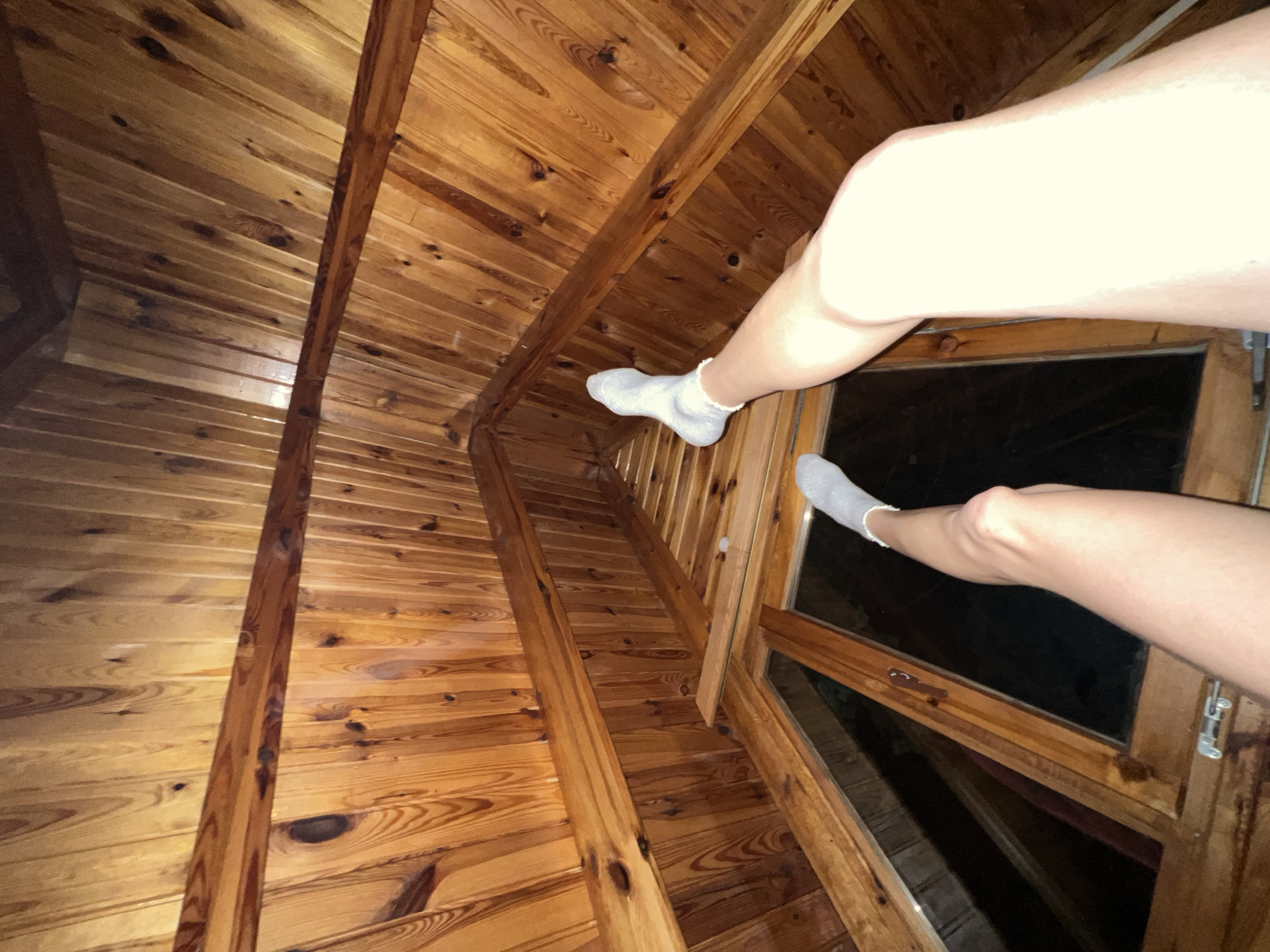 Person rests in wooden attic space in Samokov